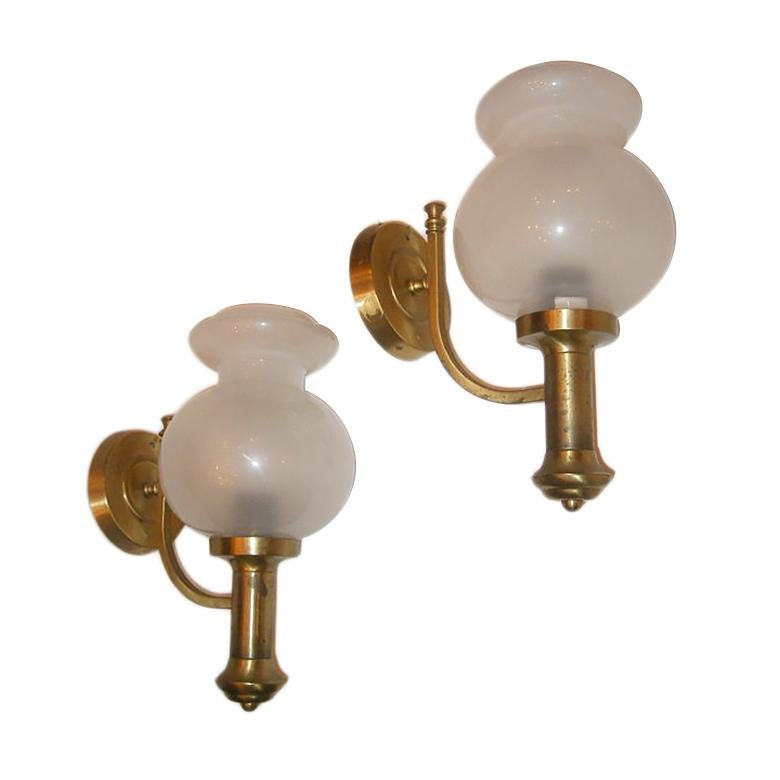 Pair of circa 1940s Italian gilt metal sconces with original opaline glass globes.

Measurements:
Height 14
