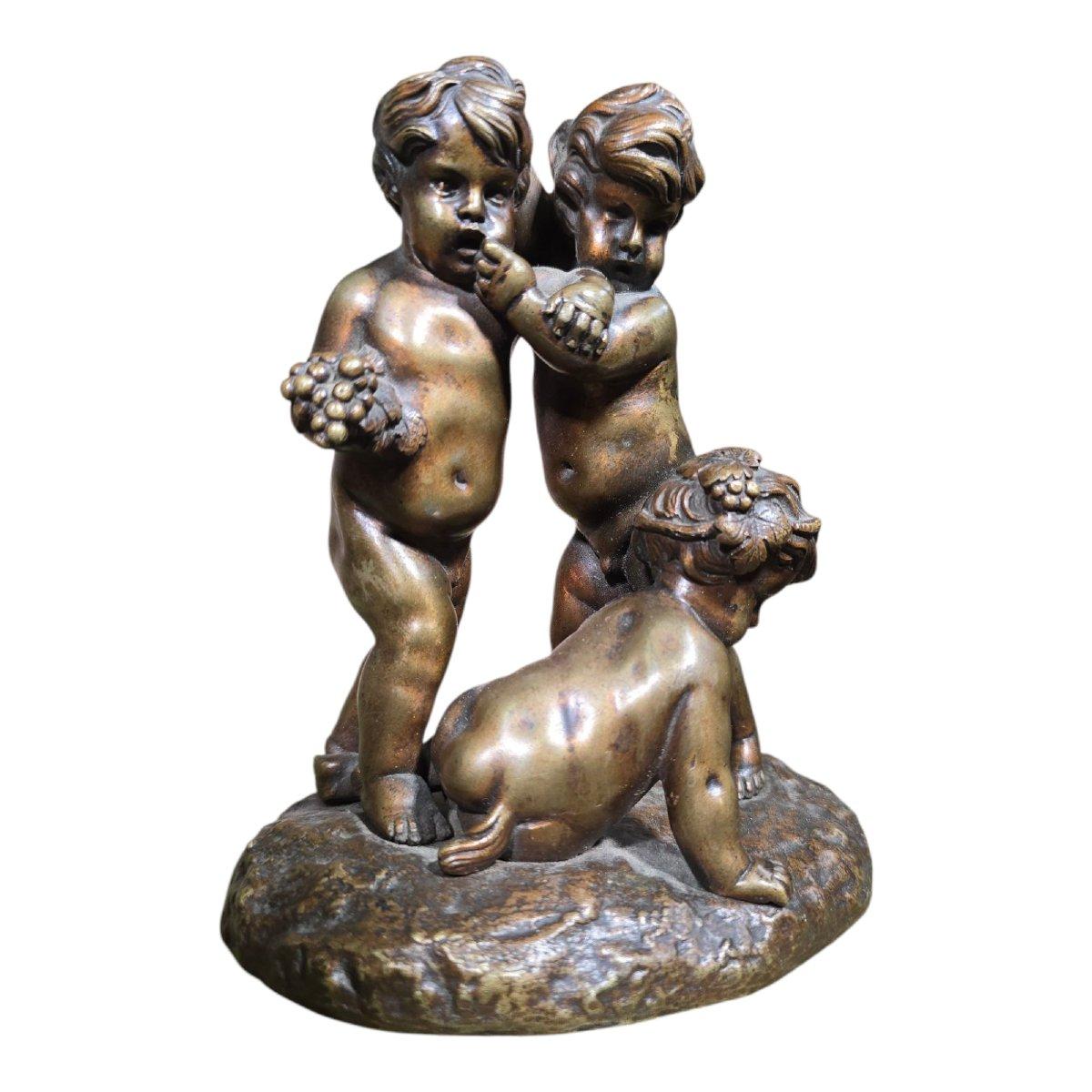 Delicate 19th-century bronze sculpture depicting two cherubs joyfully playing with a faun. This playful, mythological scene reflects the Romantic taste of the time for classical allegories and figures of children.

Period: 19th century

Material: