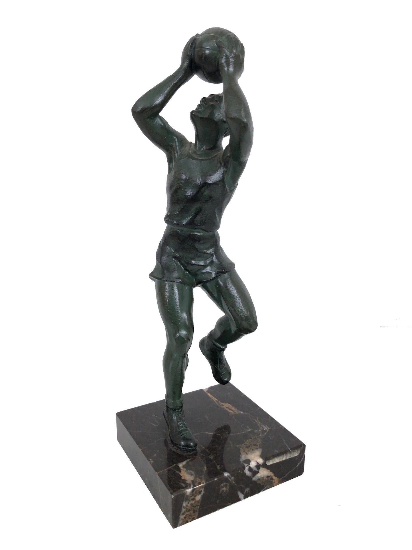 Sculpture in bronze 
Basketball sportsman 
original patina 
original Art Deco, France, 1930s 

Stone base (newer) 

Dimensions:
Width: 8 cm
Height: 23 cm
Depth: 8 cm.