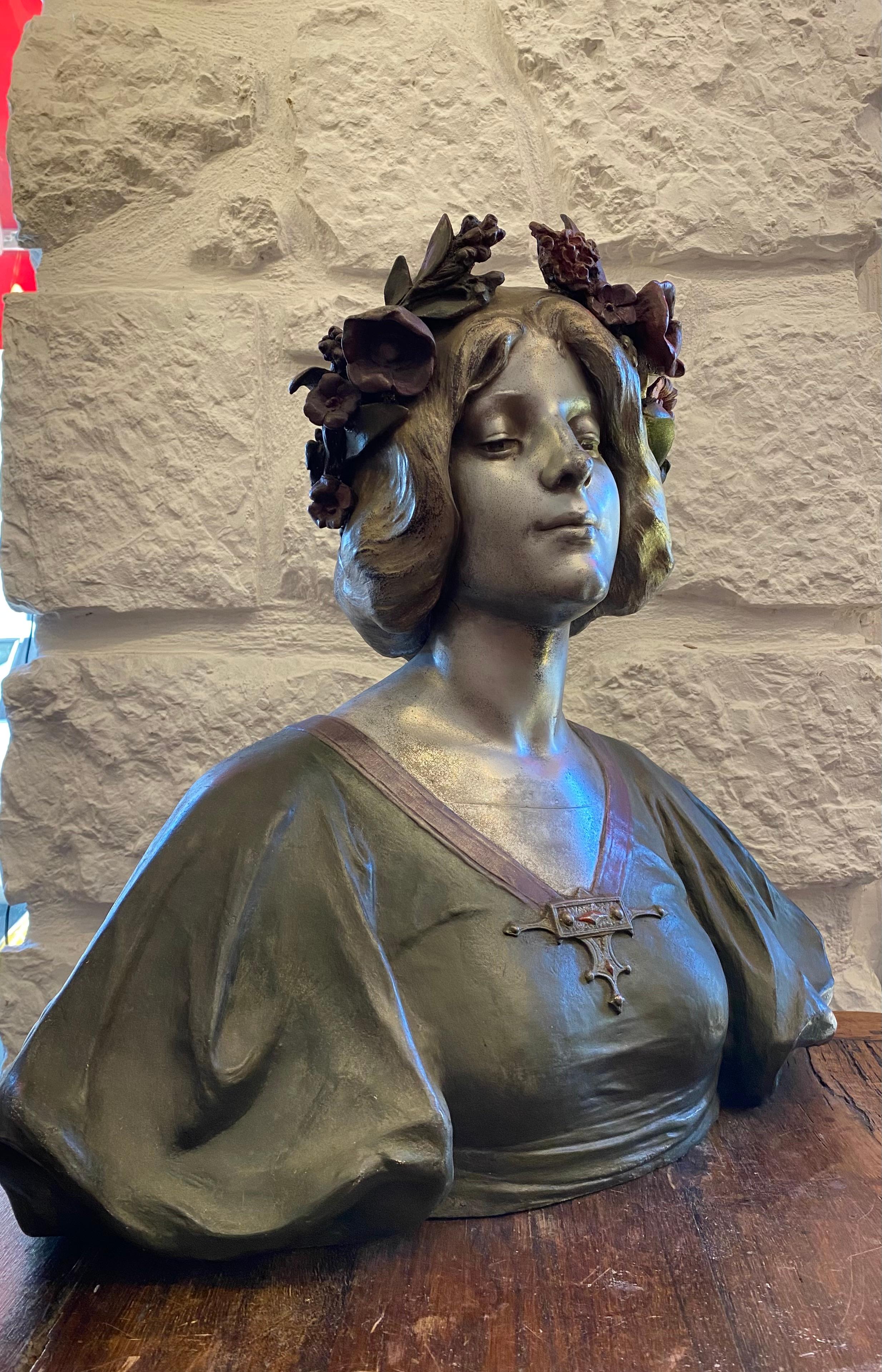 Art Nouveau bronze sculpture, polychrome, representing a woman dressed in a green dress decorated with a jewel, the head is topped with a floral crown. Signed on the back: J Caussé* *Julien Caussé (1869/1914) Student of Alexandre Falguière, he moved