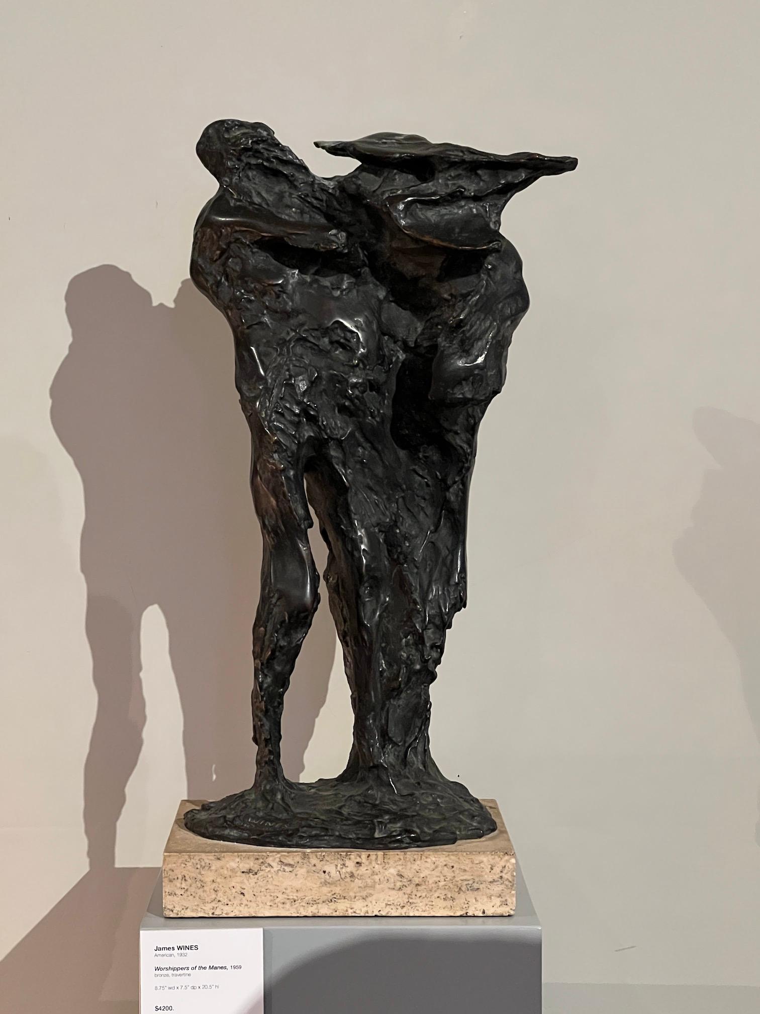 A large bronze sculpture on travertine base titled 'Worshippers of the Manes', 1959 by James Wines. 