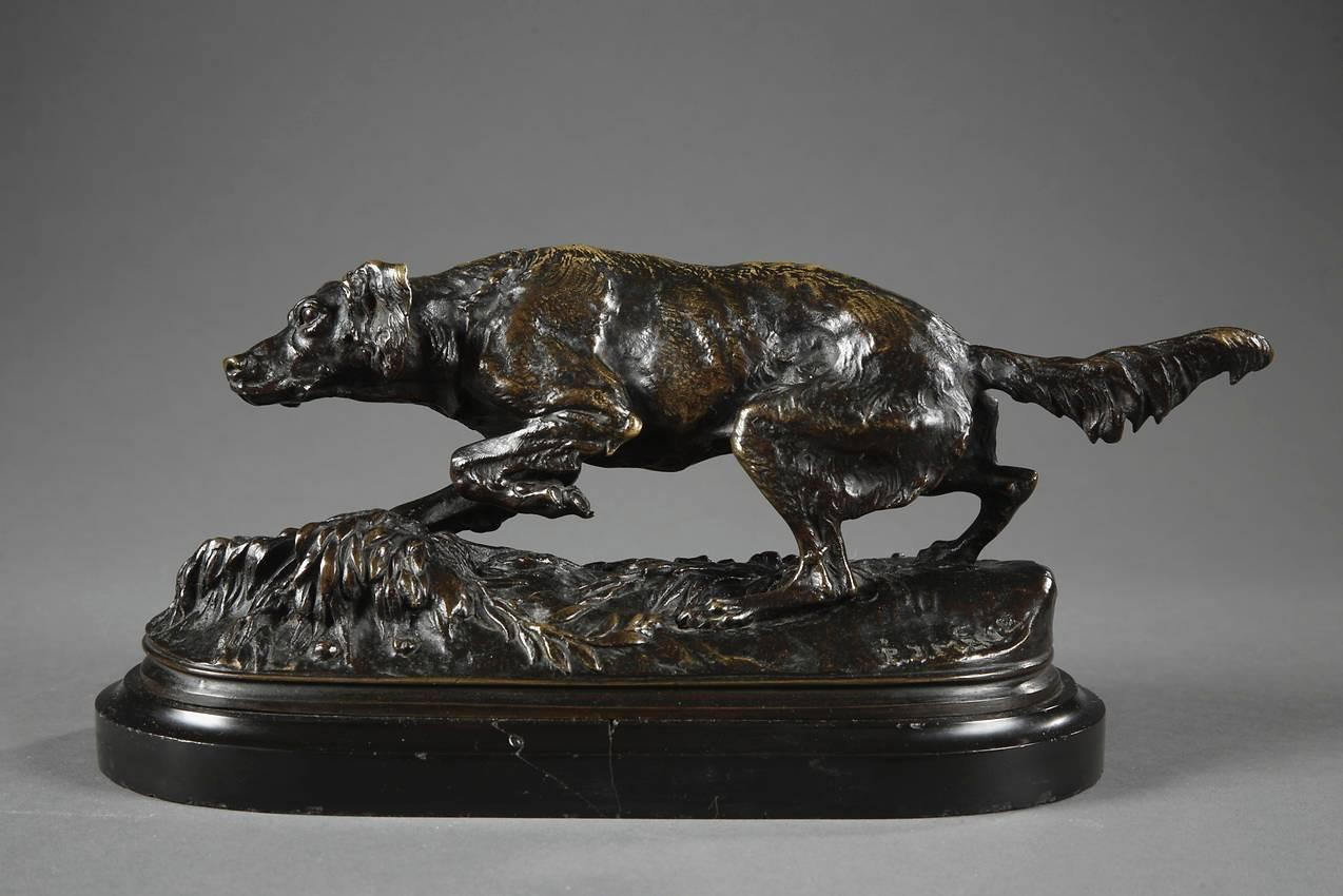Bronze with brown patina featuring a dog standing on a naturalist terrace decorated with branches and grass. Signed: P.J MENE for Pierre-Jules Mêne (French, 1810-1879). Black marble base. 

Bibliography: Similar models reproduced in Michel Poletti