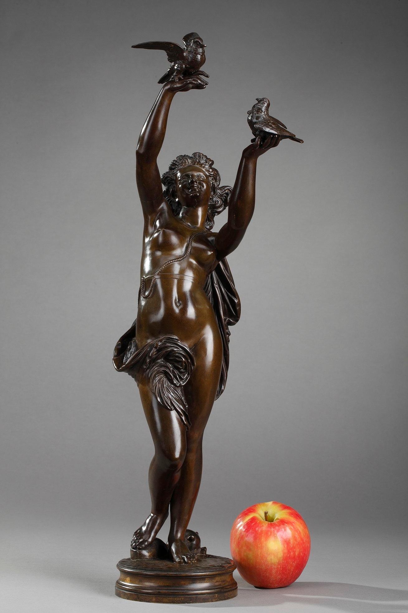Bronze sculpture with brown patina by Charles-Alphonse Gumery, featuring a smiling young woman with doves. This bronze statuette is signed: Gumery ROME. Charles Gumery most probably made this bronze during his stay at the Villa Medici in