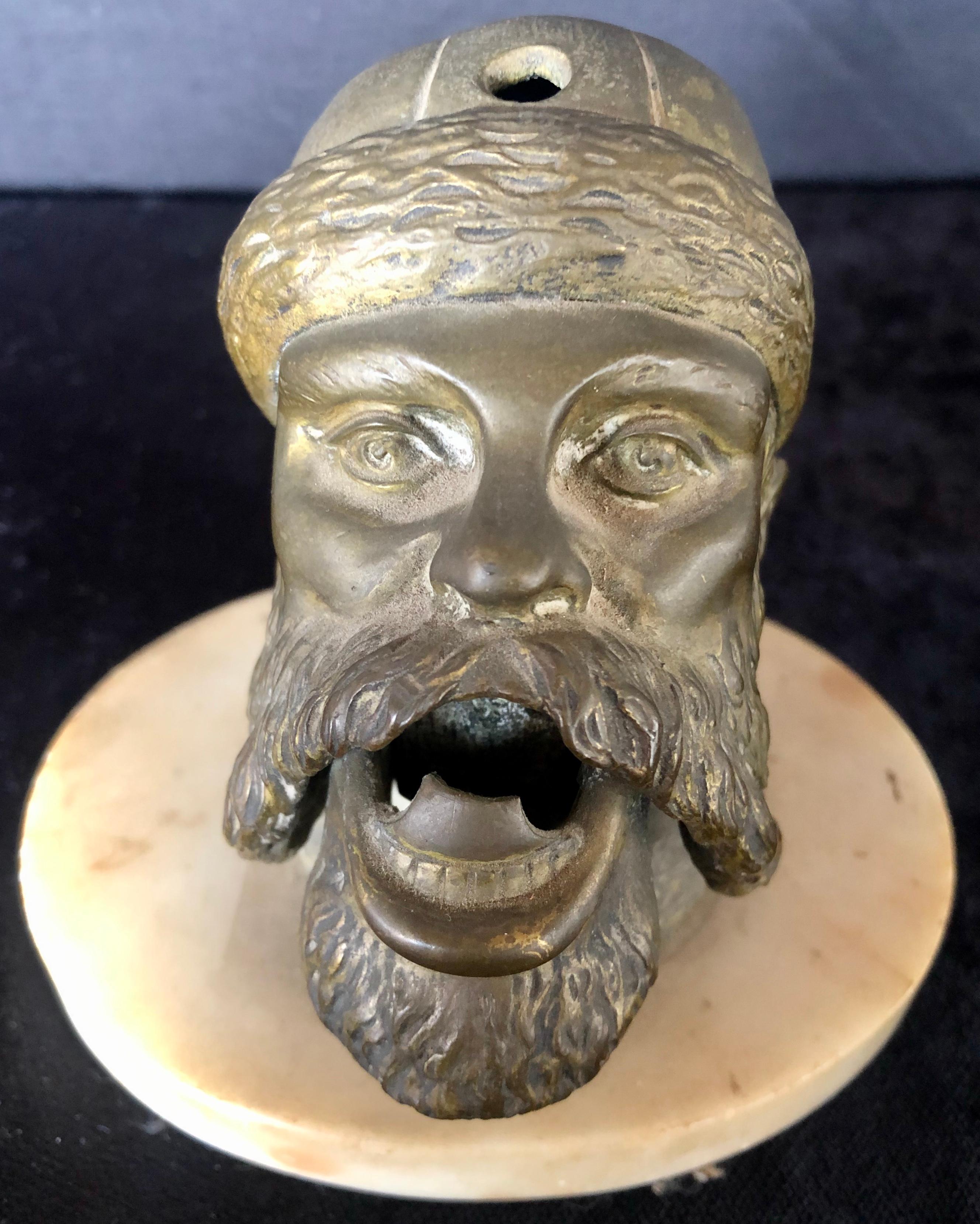 Bronze sculpture head cigar cutter on marble base a must have for any man cave or cigar room.
This is part of the personal collection purchased directly, From the estate of Jerry Terranova, Author of 