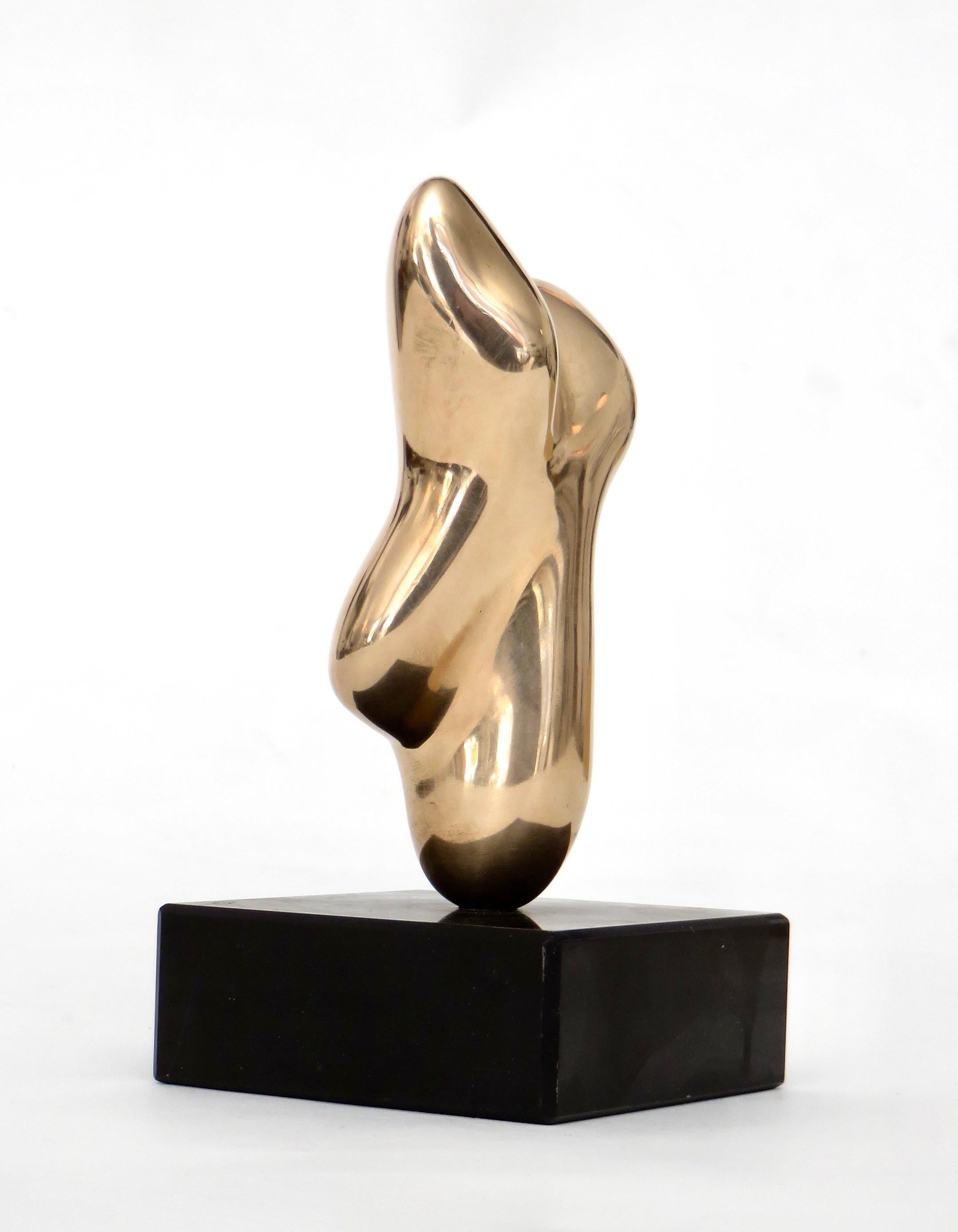 A small polished bronze figurative sculpture on a black marble base in the style of Hans Arp.
It is signed and numbered 145/500 but difficult to read. In wonderful condition both the bronze and the marble base.
Overall size: 3.25