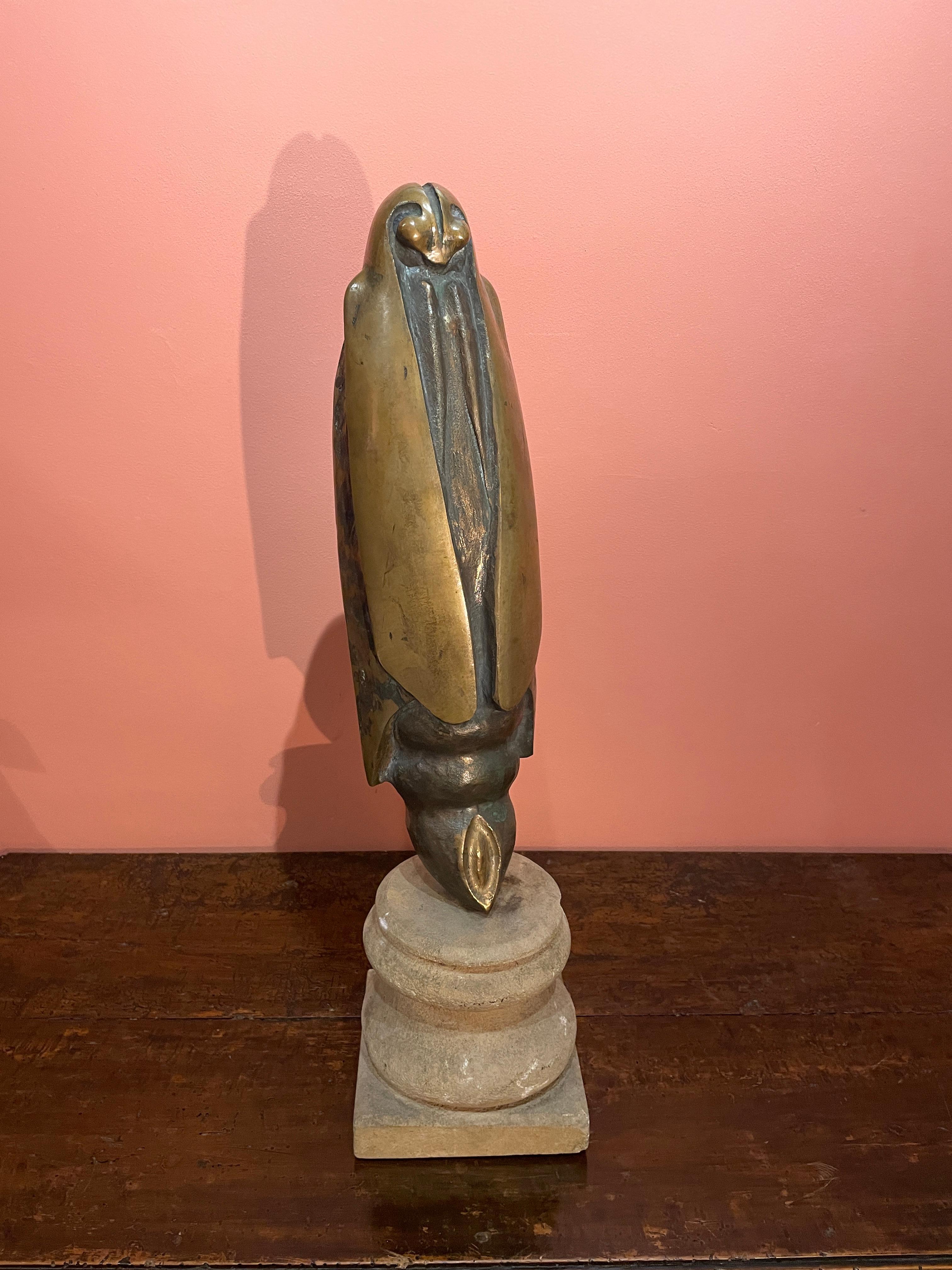The sculpture is signed at the back but unidentified yet.
Measures: Bronze sculpture
Height 43 cm, length 13 cm, depth 13 cm

Stone base
Height 15 cm, length 15 cm, depth 15 cm.