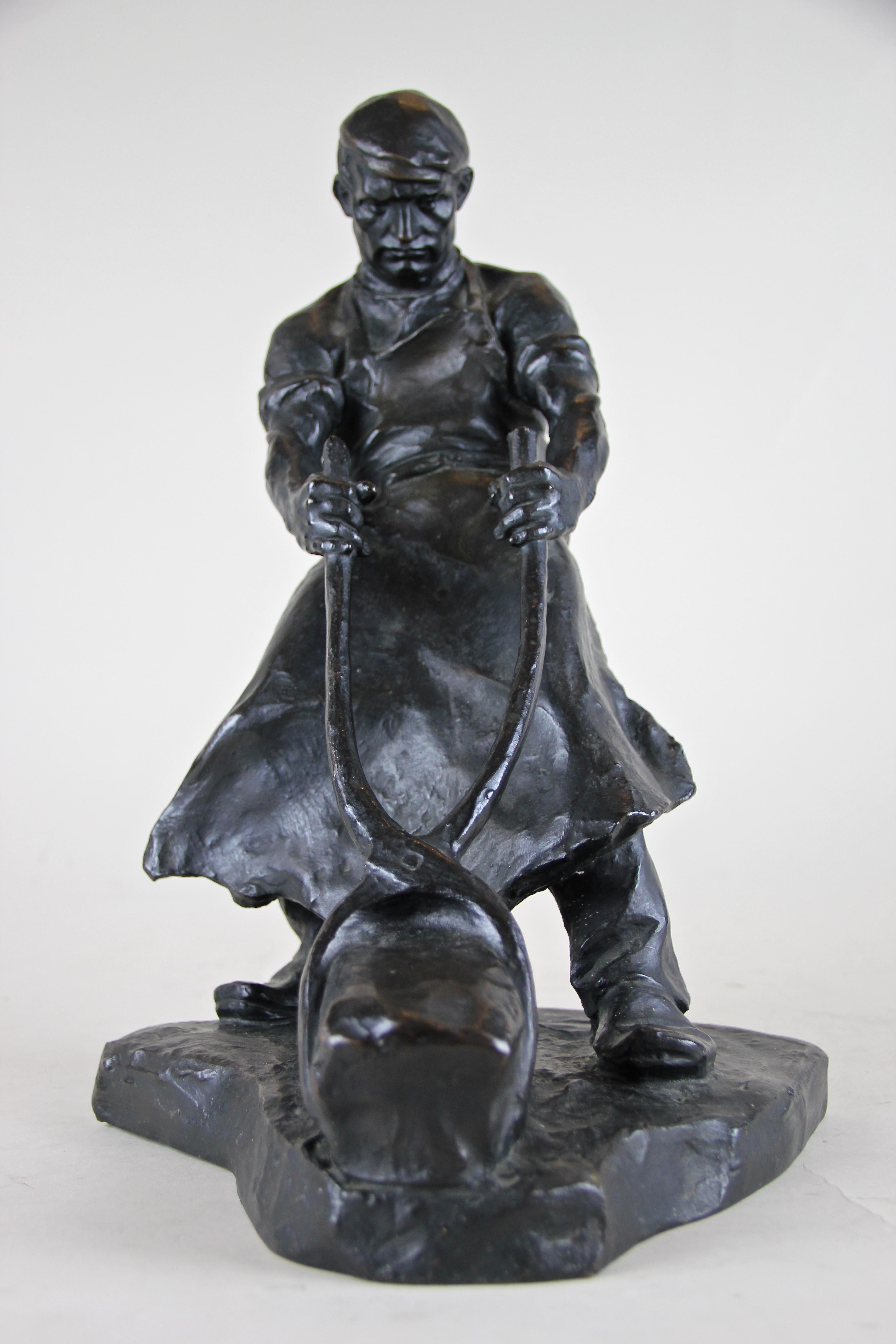 Impressive bronze sculpture by famous Austrian sculptor Hans Müller (1873-1937). This signed bronze sculpture shows an ironworker trying to grind a heavy piece of iron with a big pair of pliers. Great attention was given to details, with one look at