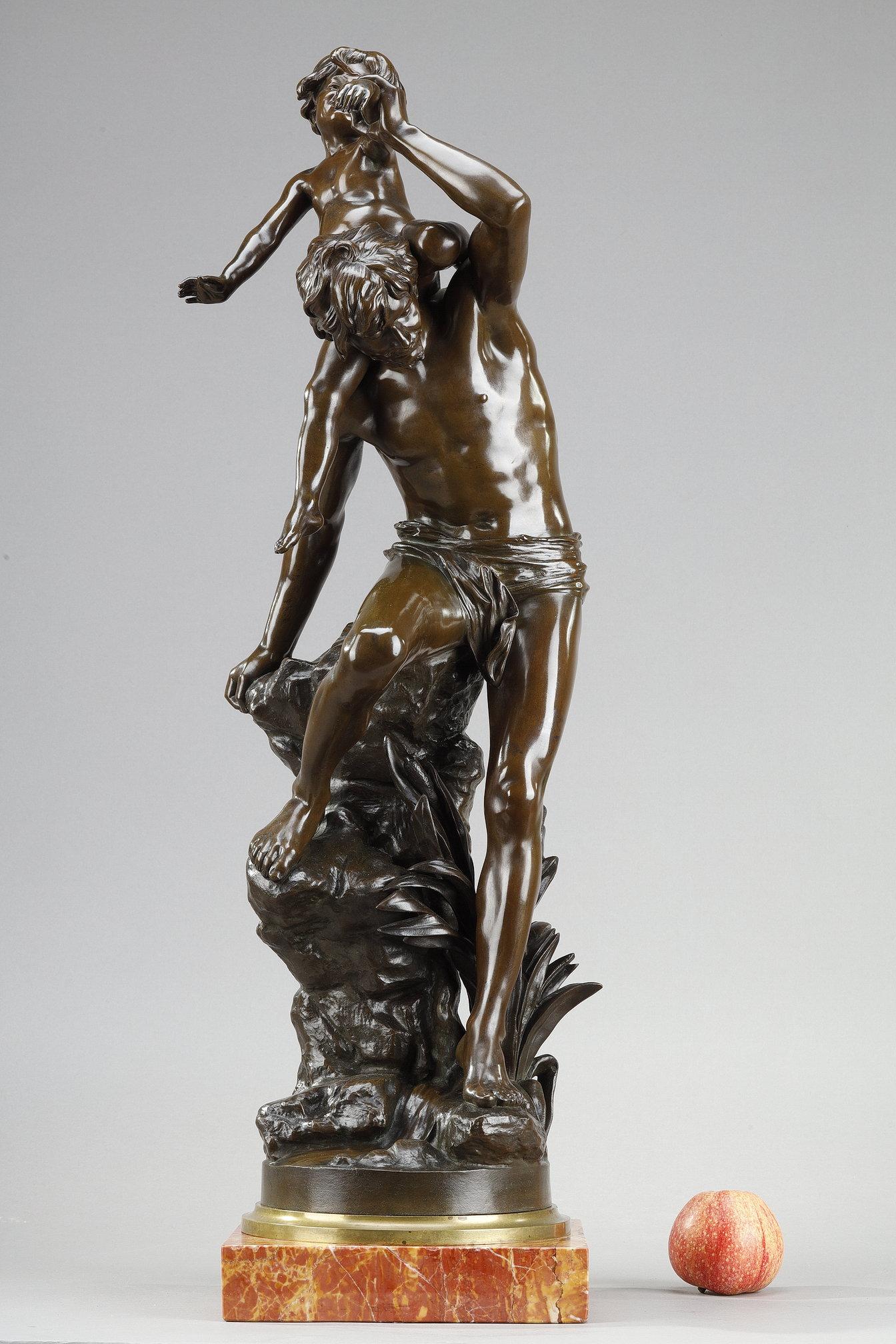 Beautiful bronze sculpture with brown patina, depicting a man standing on the side of a rock, carrying a child on his shoulder. The bronze rests on a quadrangular red marble base and is signed G. Leroux on the terrace. Leroux.

Gaston Leroux, also