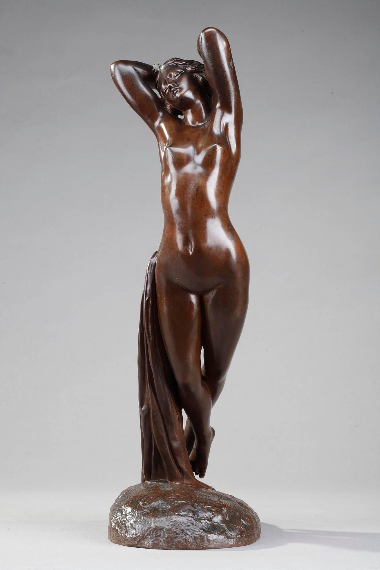 Early 20th century patinated bronze sculpture of a standing nude woman aurora with draped cloth, floating in the air. She wears a five-pointed star atop her head and is combed with roses. Signed on the base: Collet Scpt (Collet Sculpsit). Illegible