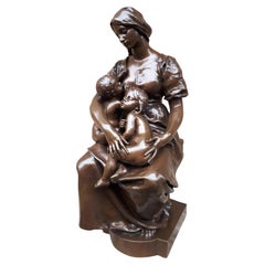 Sculpture en bronze d'une mère allaitant, par Paul Dubois