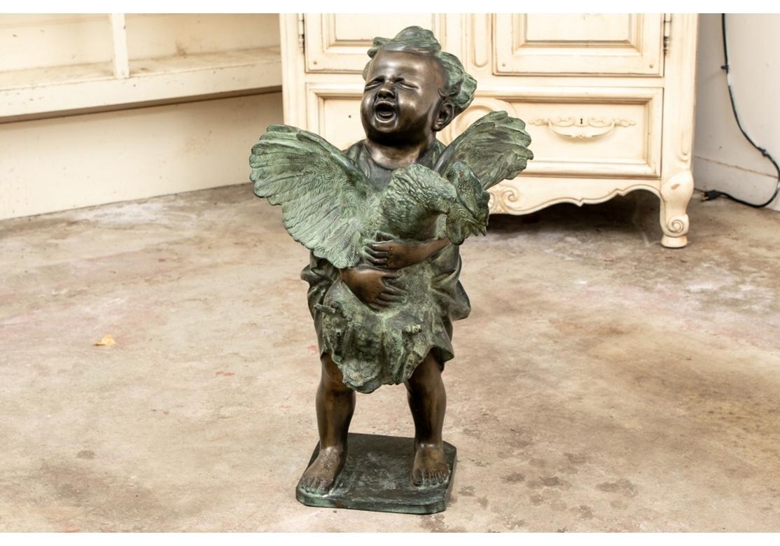 Cast Bronze Sculpture of a Child Holding an Unruly Rooster For Sale