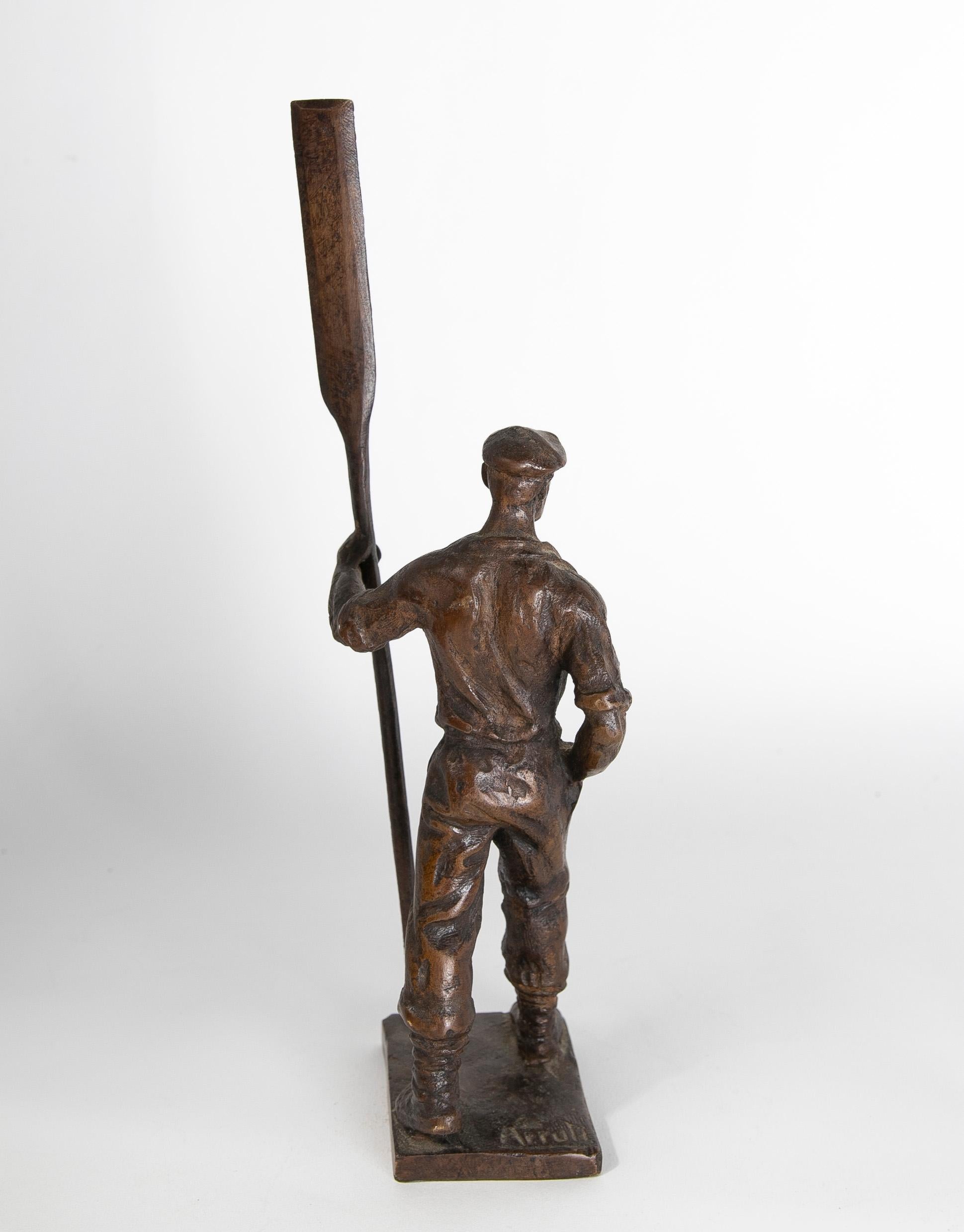 Bronze Sculpture of a Figure with Oar Signed Arruli For Sale 1