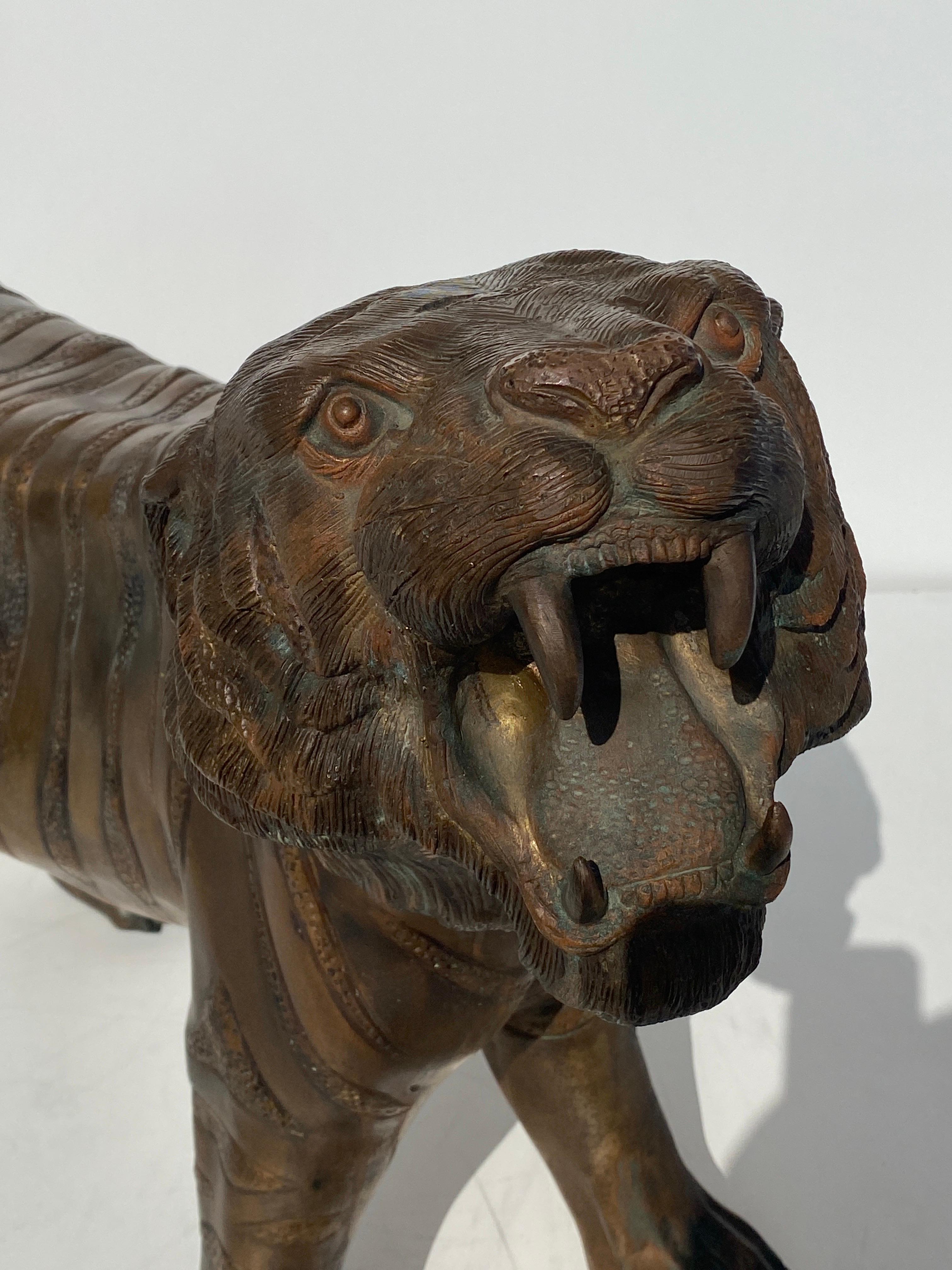 Patinated Bronze Sculpture of a Roaring Tiger For Sale