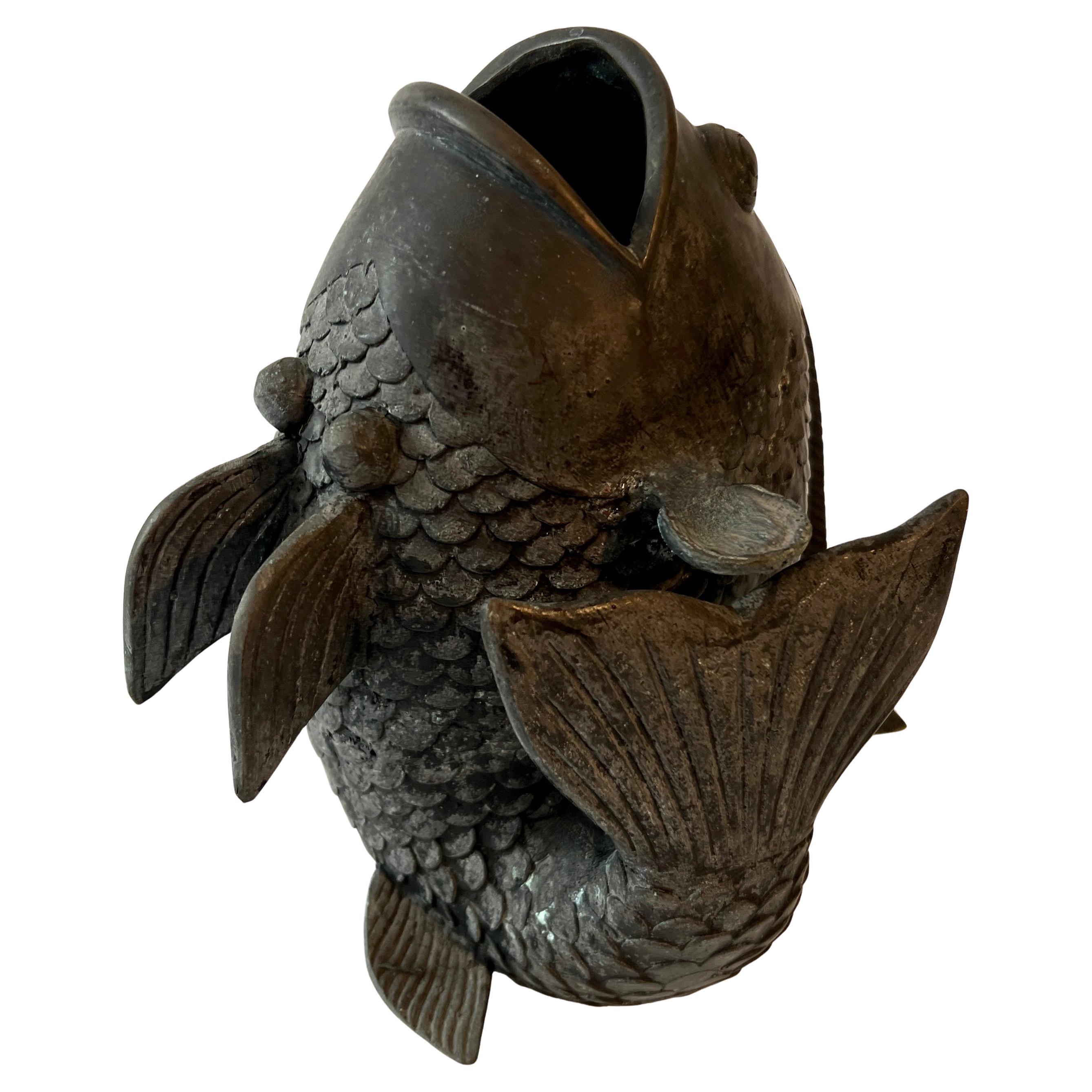 A Bronze Koi Fish.  The beautiful fish can be used as a decorative piece, a vase, and if you're really ambitious, could make a lovely fountain.

A compliment to any space - living room, den, kitchen, guest room, etc. as a decorative piece, and the