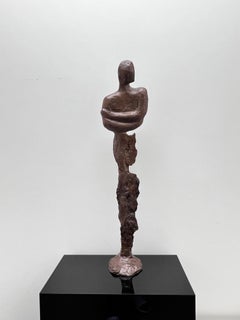 A sculpture of a male figure,  cast