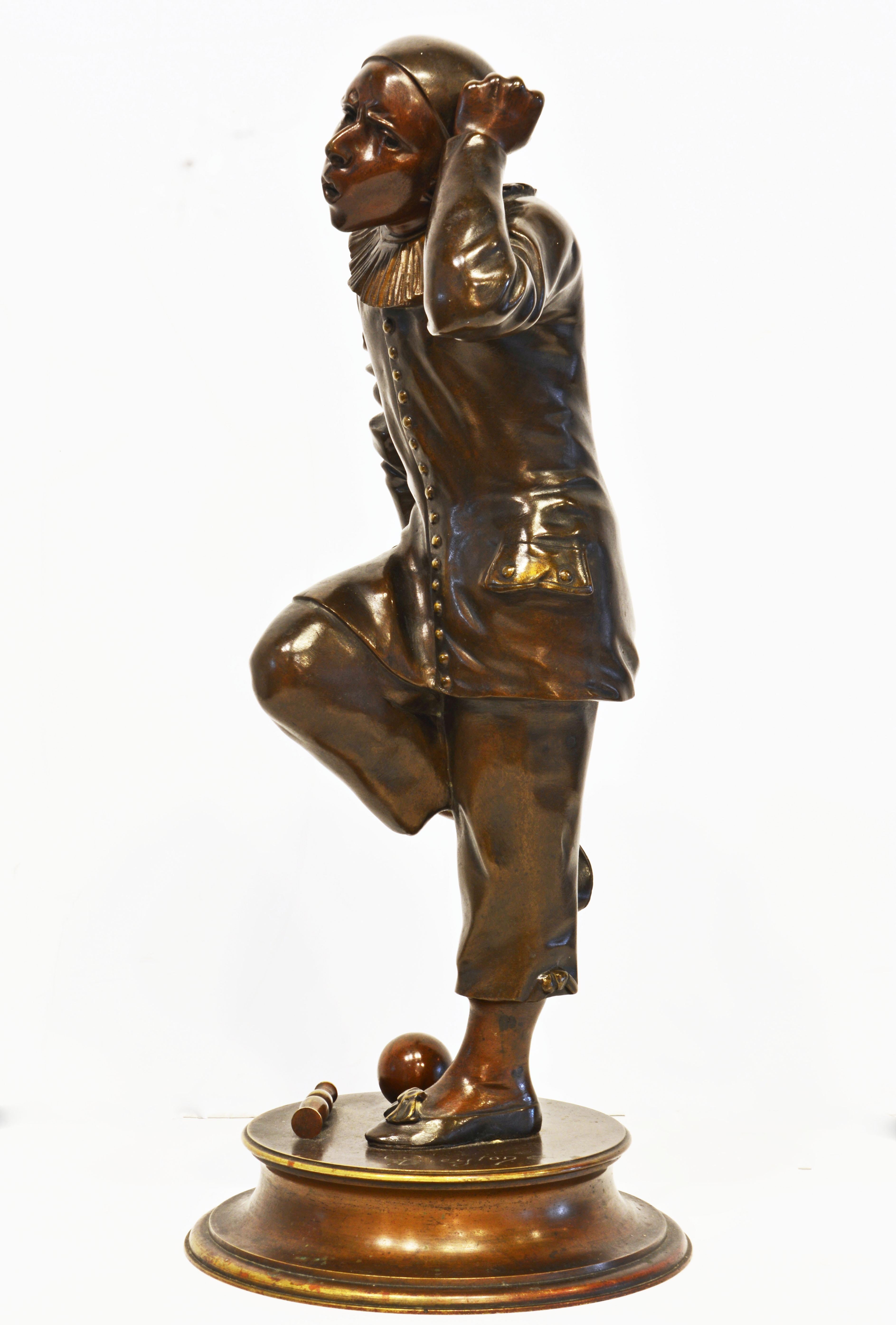 This fine and touching bronze figure of a jester in one of his traditional poses is by the French Sculptor G. Guyeton (1841-1919) and likely dates to around 1880. It is standing on a signed circular base presenting some of his 'tools of the trade'.