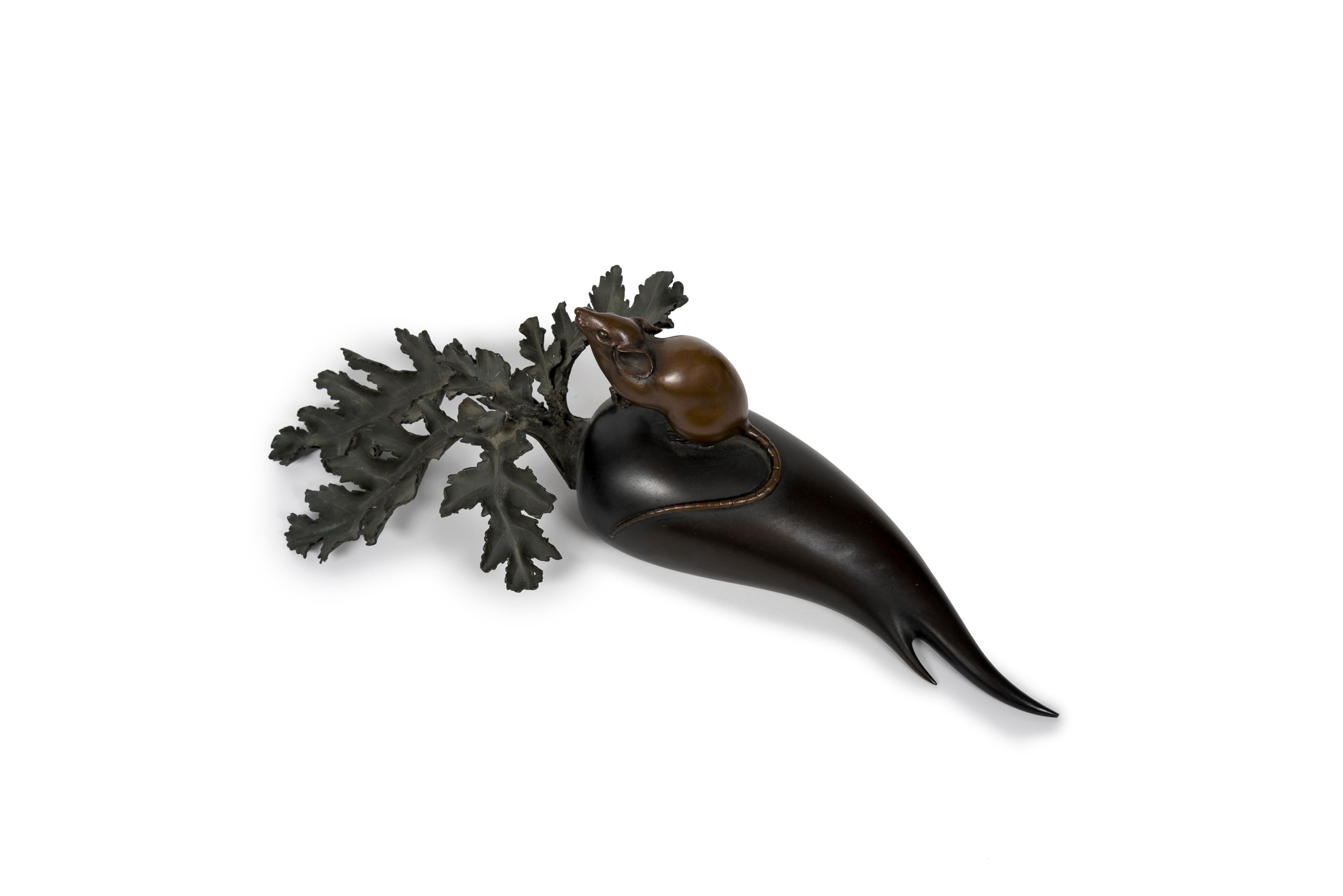 This beautiful bronze okimono depicts a mouse delicately perched on a leafy radish. The mouse, resting on its two hind legs, has a long tail that wraps around the radish. Each element — the mouse, the radish, and its foliage — displays a unique