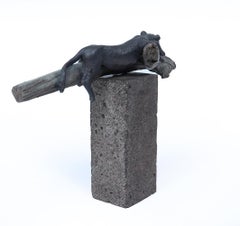 Bronze Sculpture of a Resting Lioness on Cold-Painted Log