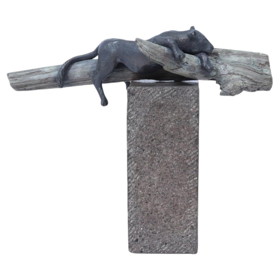 Bronze Sculpture of a Resting Lioness on Cold-Painted Log For Sale