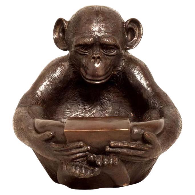 Bronze Sculpture of a Sitting Monkey Holding a Bowl