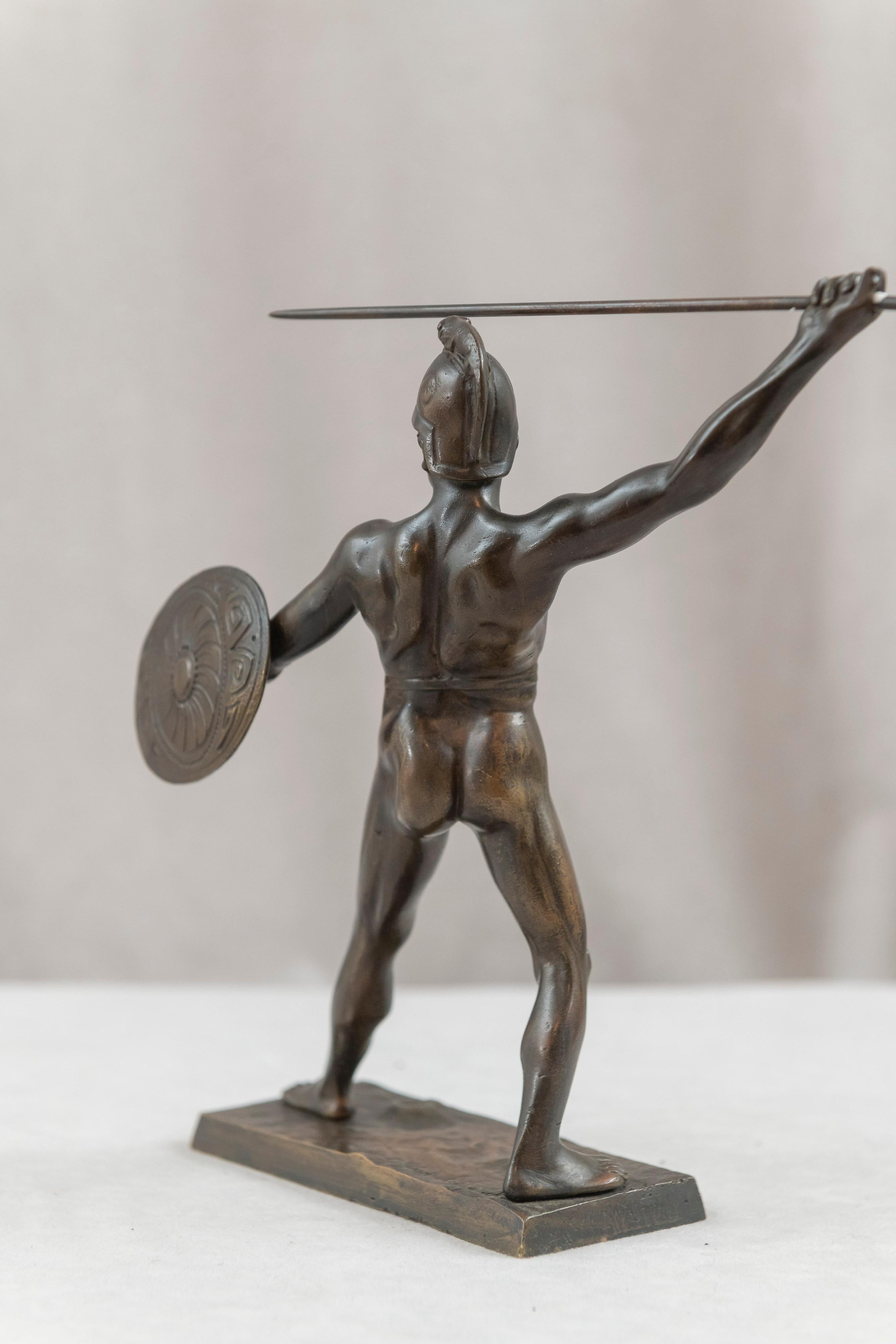 This is a handsome bronze of a warrior in full action mode. Ready to throw his spear and holding his shield for protection. Artist signed, but we haven't been able to ascertain more about the artist. We do know it is antique. In fact many of our