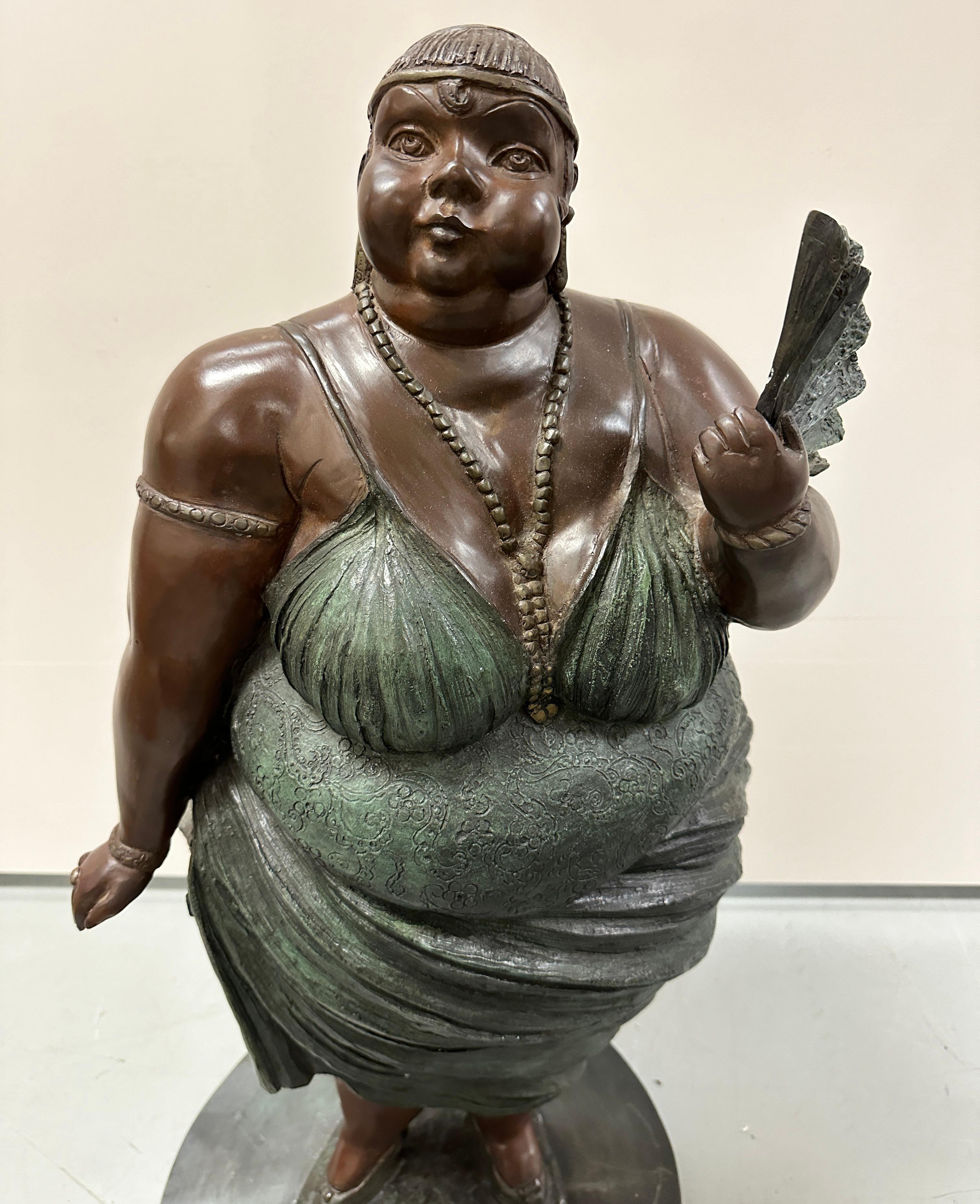 Whimsical patinated bronze sculpture of a full size woman by Mexican artist Bruno Luna (b. 1963) Woman With fan, 