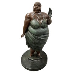 Escultura de bronce de una mujer de Bruno Luna "Doña Bella"