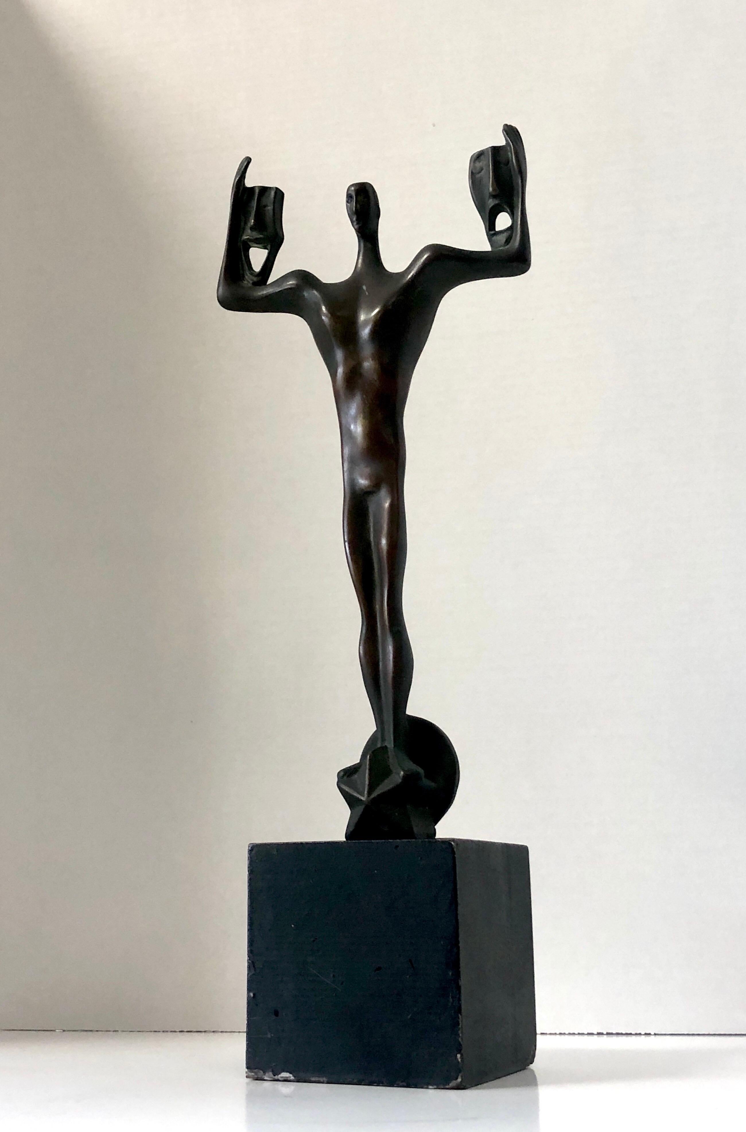 A midcentury bronze sculpture. Believed to be an acting award. An abstract stylized man holding drama and comedy masks while standing on a star. Wood block base. Signed ineligibly.