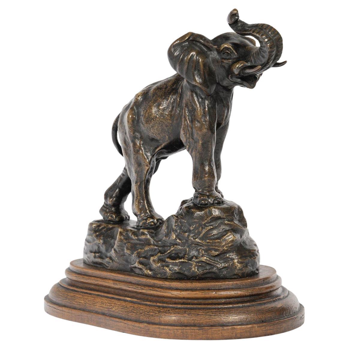 Bronze Sculpture of an Elephant, Trunk Raised, in Patinated Bronze, E. Bernard.