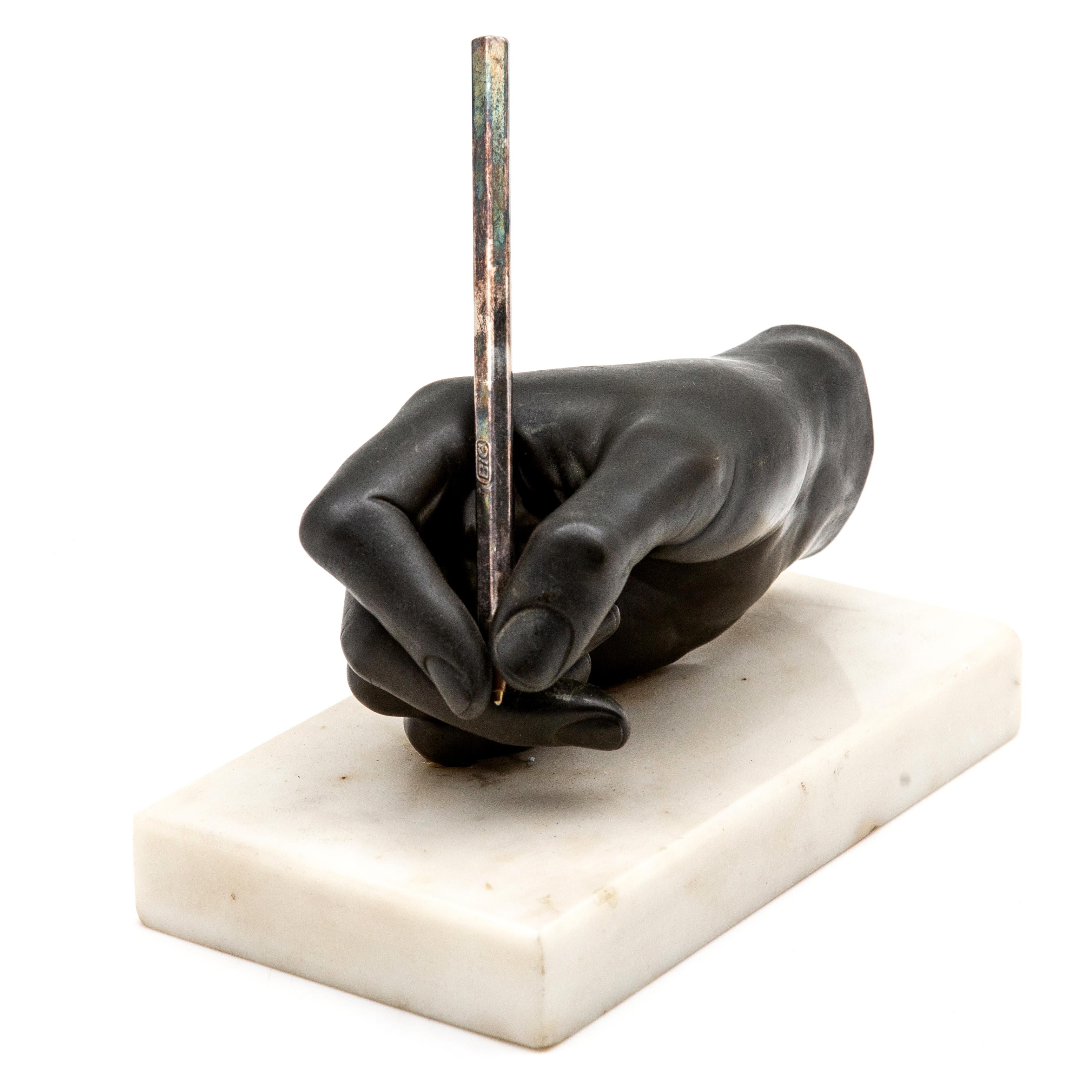 Bronze sculpture of hand on marble base. Bronze writing hand with pen on rectangular marble base, 19th century. Measures: 7.5