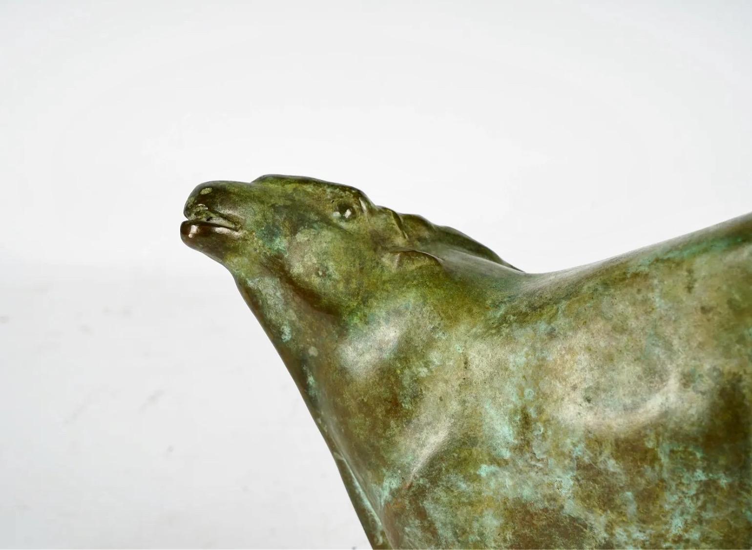 This is a stunning emotive abstracted sculpture of a kneeling antelope that is crafted in bronze and signed by the artist , Barbara Beretich (1936 - 2018), on the bottom. The sculpture is beautifully cast with fine detail and patina. 

During