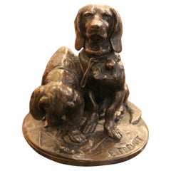 Bronze sculpture of two bassets