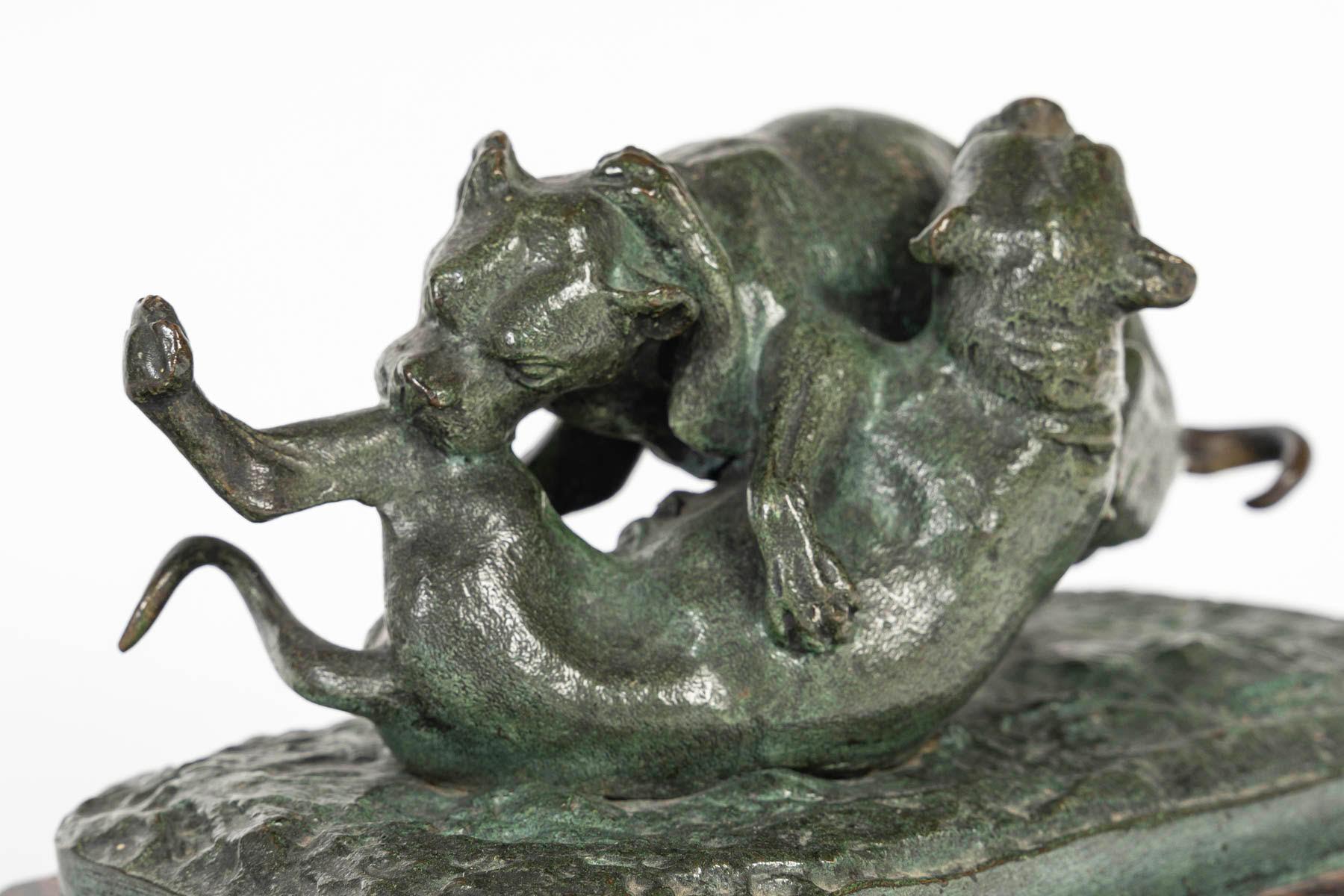 Bronze sculpture of two dogs playing on a marble base, 19th century, Napoleon III period.

A 19th century Napoleon III period bronze sculpture of two dogs playing, green patina bronze, griotte marble base.
H: 11cm, W: 20.5cm, D: 12cm

