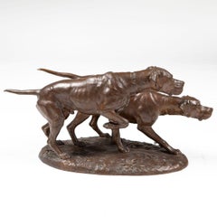 Bronze sculpture of two pointers in hunting position