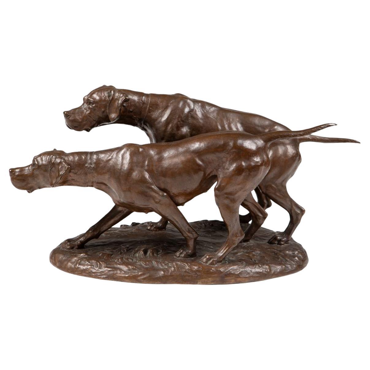Bronze sculpture of two pointers in hunting position