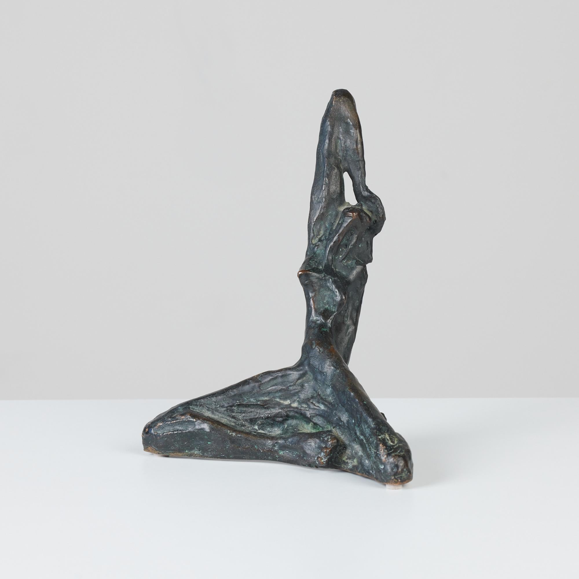 Bronze sculpture by artist Carl Tasha, c.1970s, USA. Tasha was a sculptor from Provincetown, Massachusetts, known for his bronze jewelry, belt buckles and sculptures. This particular piece is of a feminine figure with one arm stretched over head