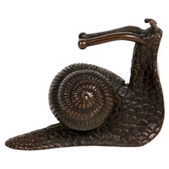 Bronze sculpture or Okimono in the form of a snail in an interesting pose