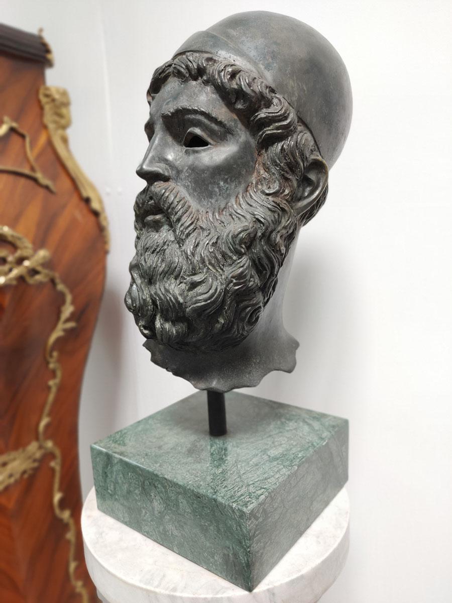 half face greek statue