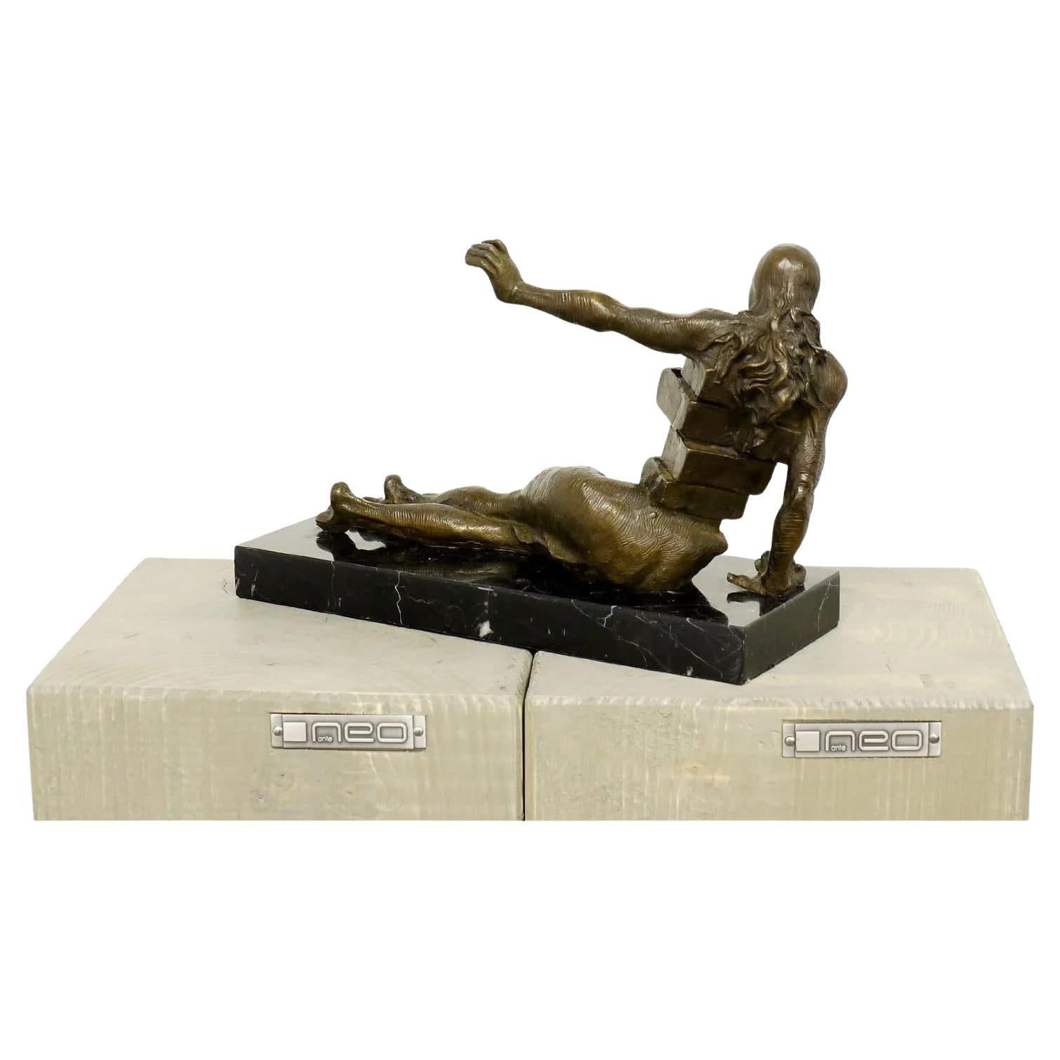 The Anthropomorphic Cabinet is a bronze sculpture depicting a stylized human body with integrated drawers, symbolizing layers of the unconscious and repressed memories. The piece reflects Salvador Dalí’s surrealist language, combining human anatomy