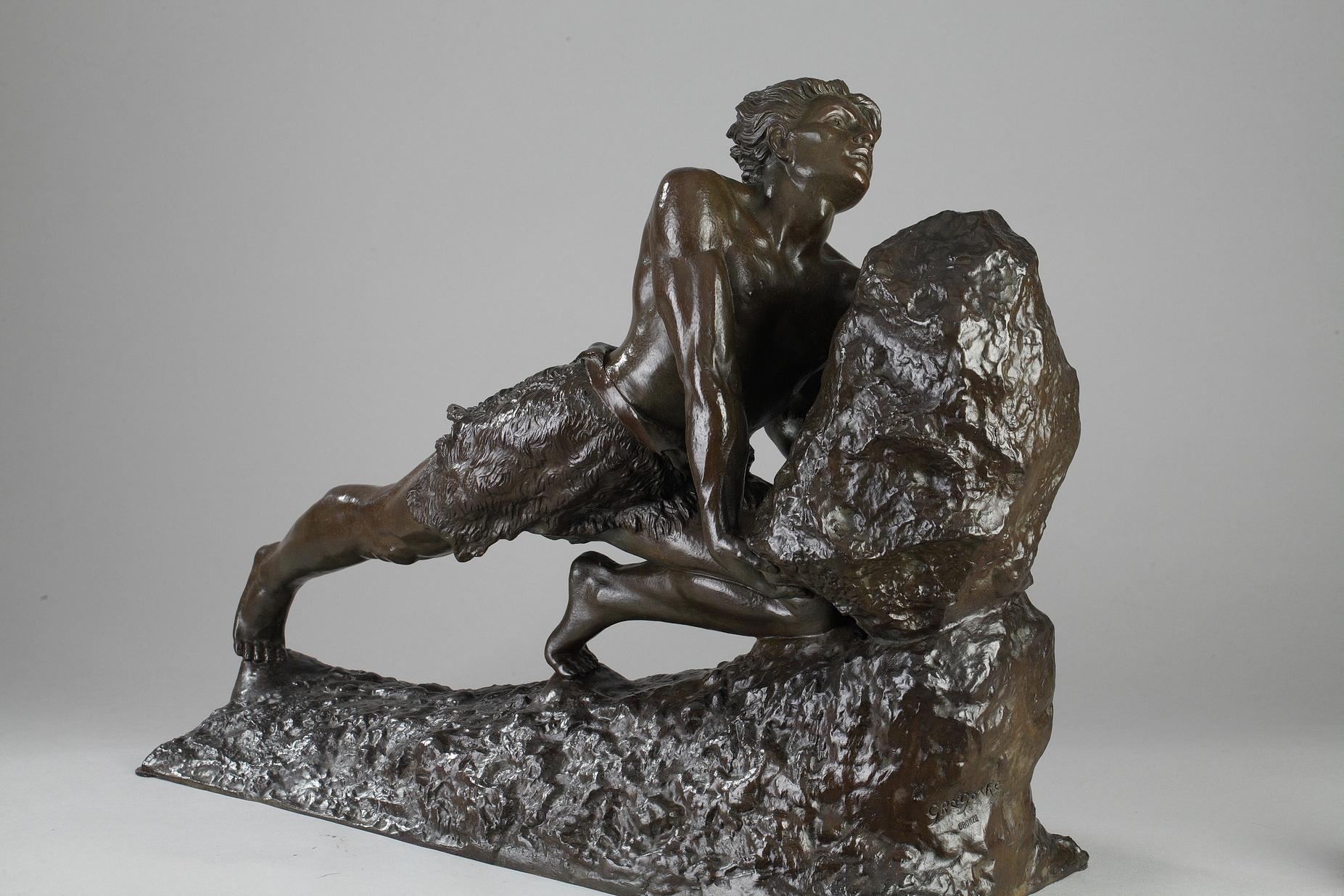 Large, patinated bronze sculpture featuring Sisyphus pushing his boulder up a hill. He was condemned to push the boulder up the hill, only to watch it roll back again and then begin the task again, for eternity. This Greek tale of futility