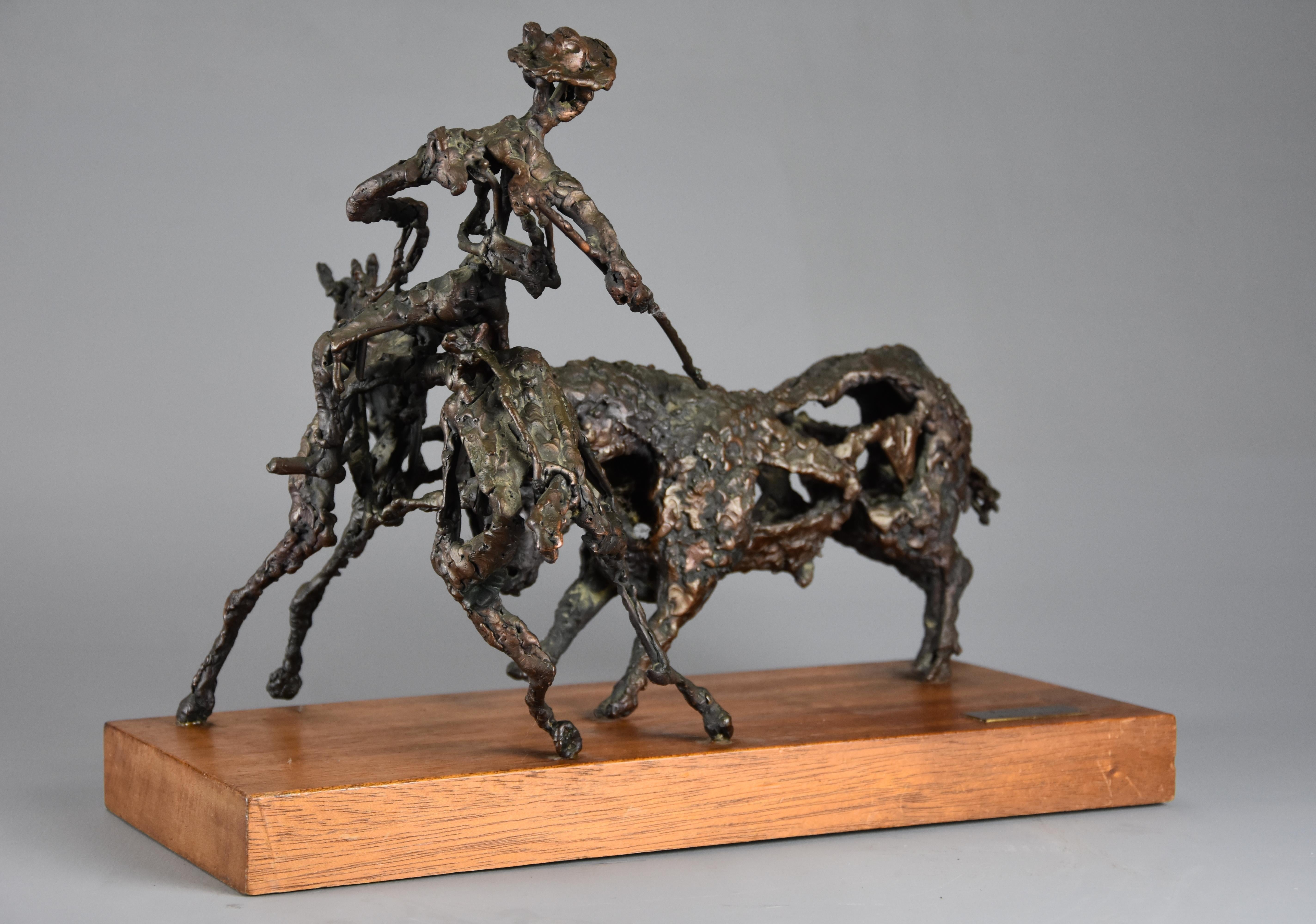 A bronze sculpture 'The Picador' by Daniel Rintoul Booth (1932-1978).

This bronze portrays a bronze Picador (or horseman in a Spanish bull fight) on horseback holding his lance near to the bull as he prepares the bull for the Matador, supported
