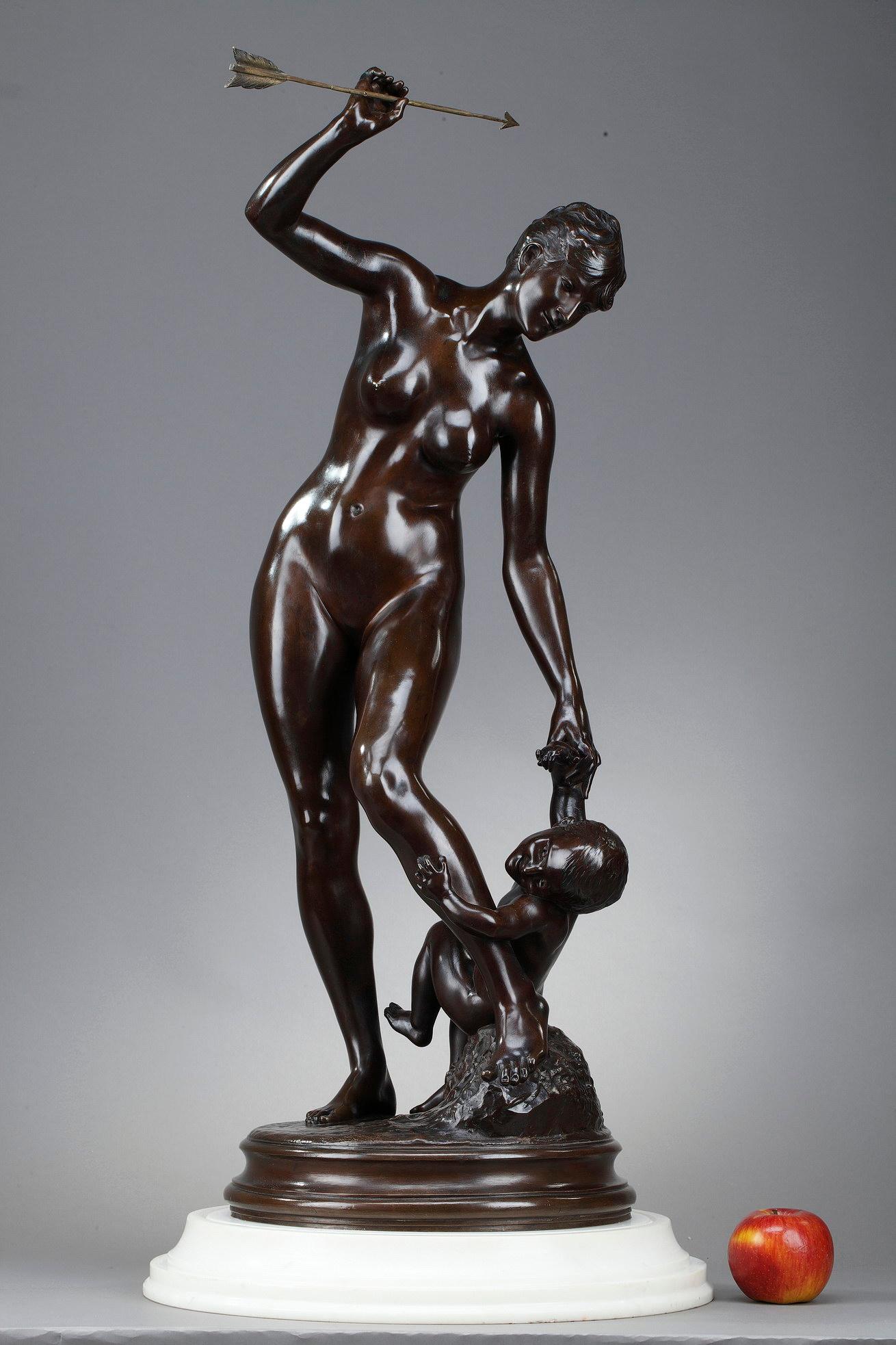 Bronze sculpture with brown patina signed Edmé Antony Paul Noël (1845-1909), representing Venus and her son, Love. Venus, naked, is holding an arrow that she has just snatched from the hands of Love that she is holding with the other hand at her