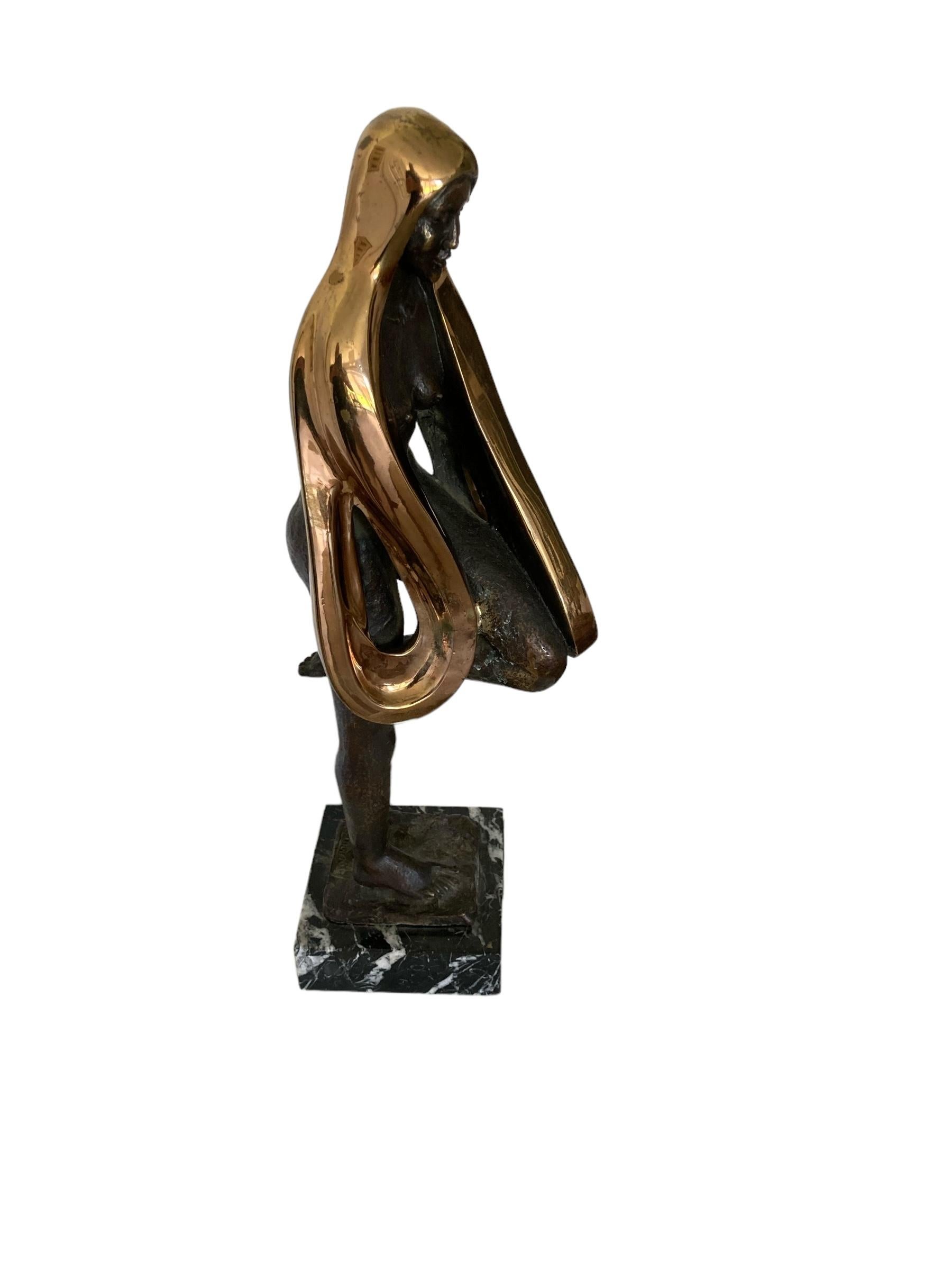 A Beautiful Bronze Sculpture with Golden decor of Naked Women on marbel base Titled 'Libelula' by Jose Manuel with signature plaque and moulded name on statue. This elegant but imposing sculpture has unusal features with the naked women standing on