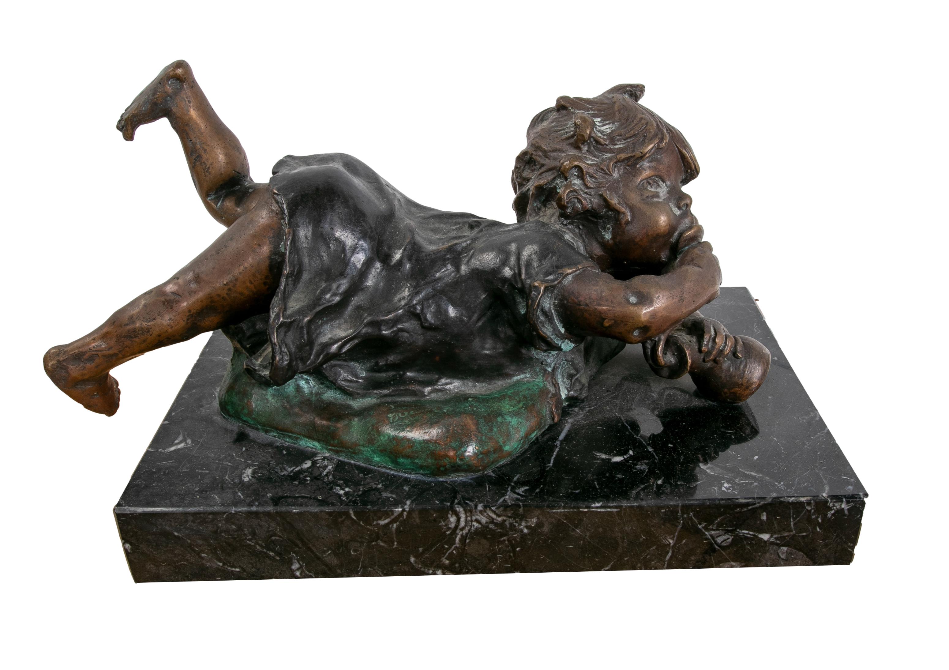 20th Century Bronze Sculpture with Marble Base of a Little Girl Lying Down. For Sale