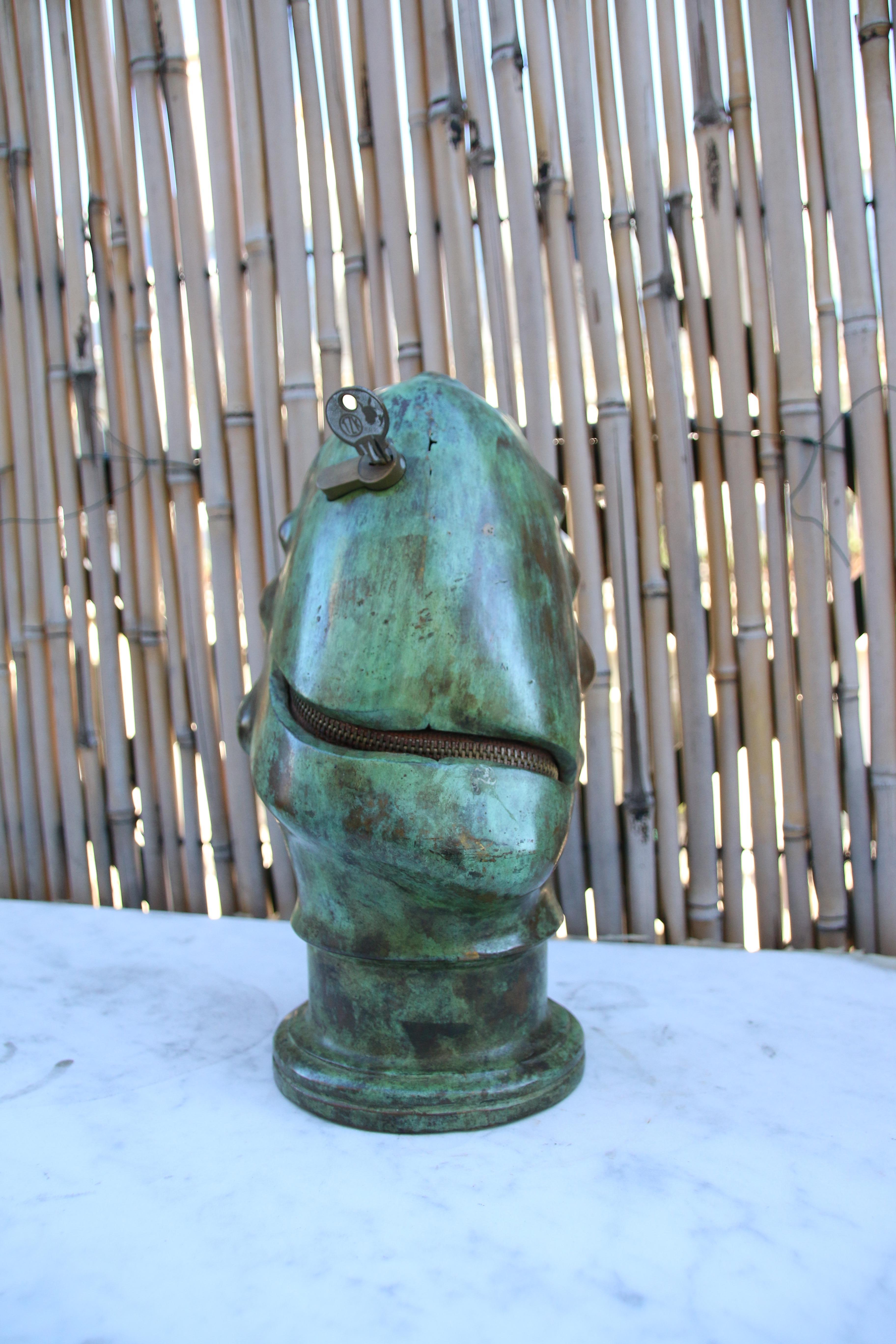 Bronze with green patina.