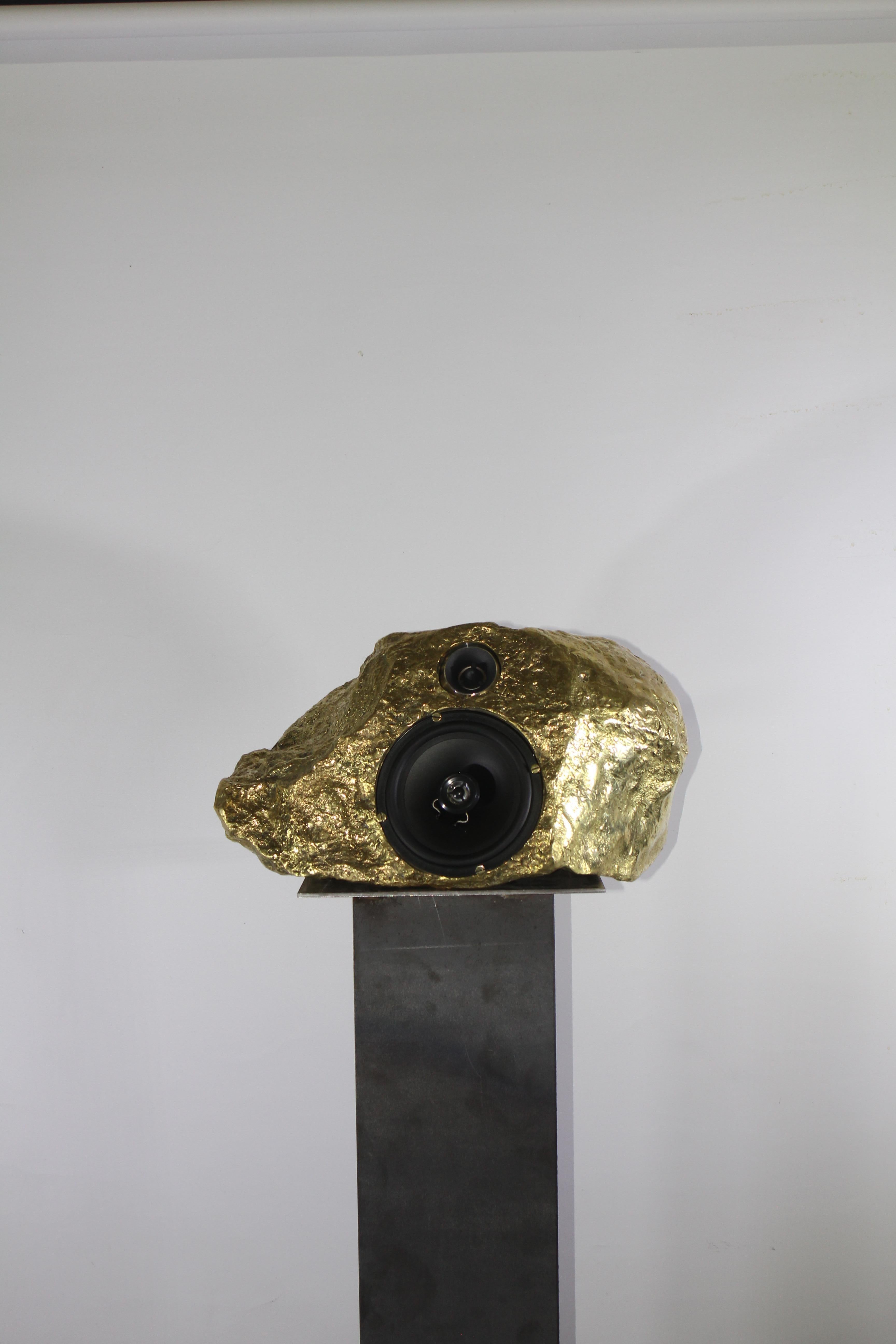 Playfully hinting at popular outdoor rock shaped speakers, this bronze cast music box domesticates the shape of a stone found in the mountains near Mexico City. A  listening- stone-for-interiors that explores connections between sound and sculpture.