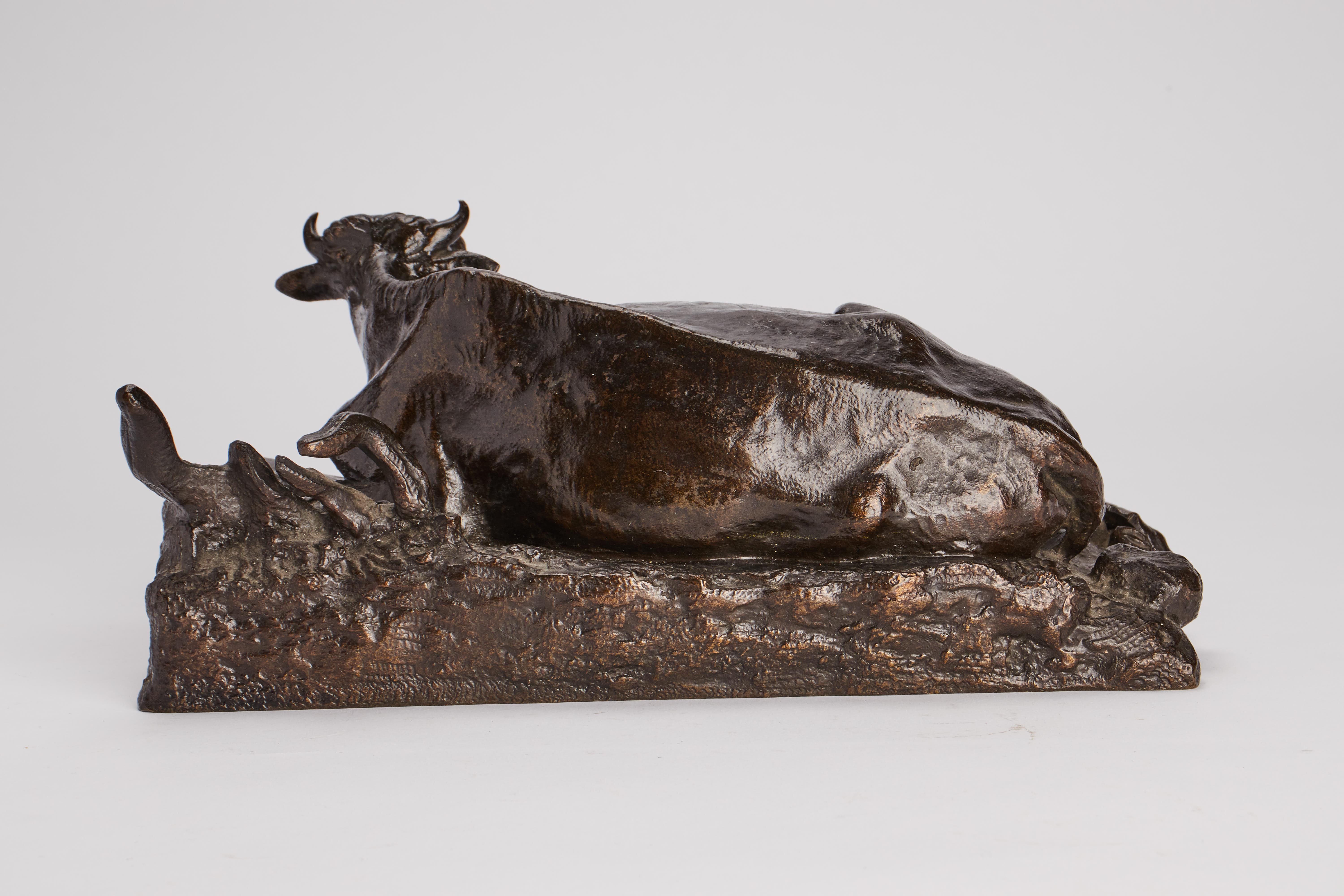 19th Century Bronze sculture depicting a layning cow signed Fessart, France 1870. For Sale