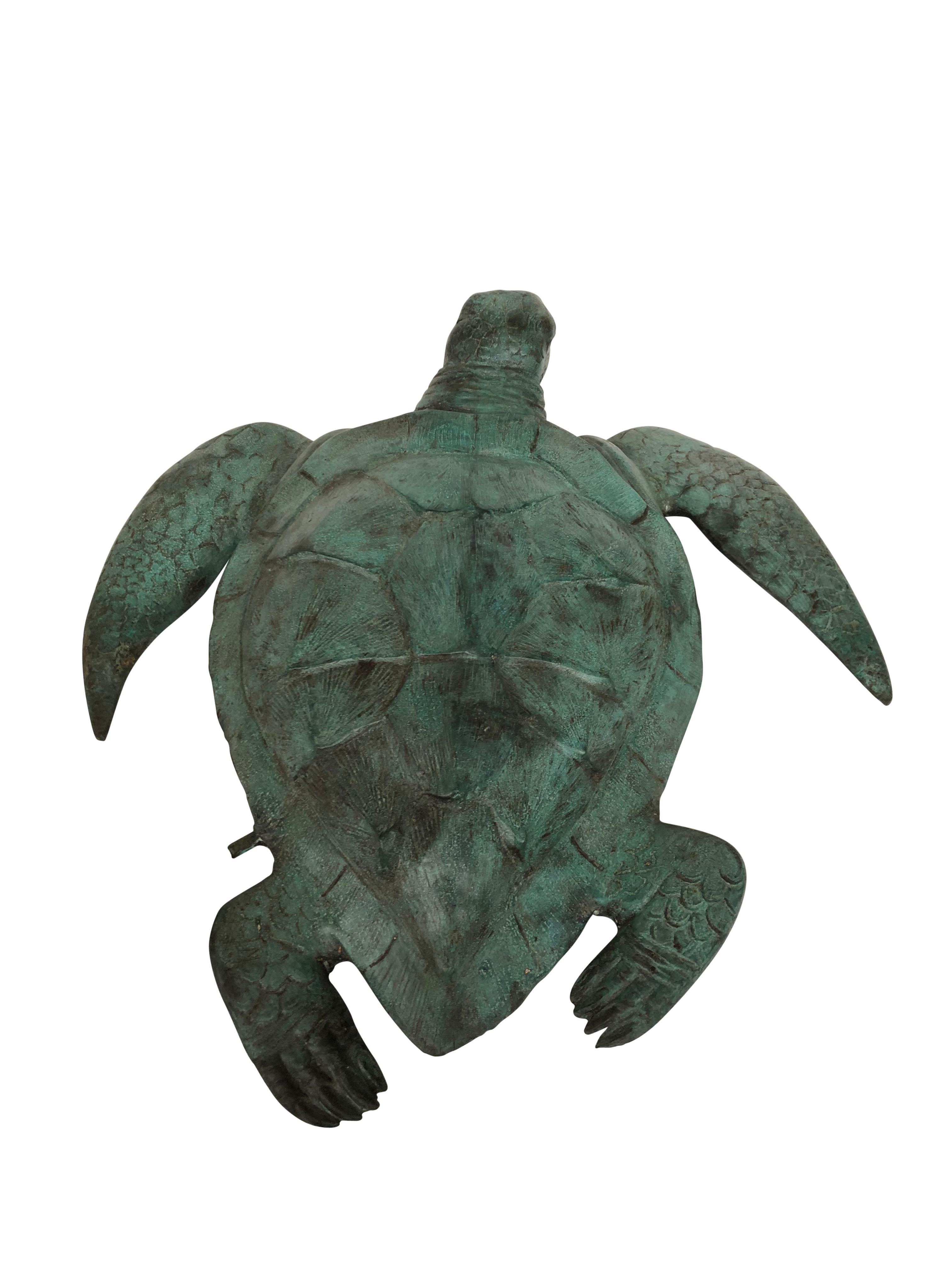 A gorgeous bronze casting of a sea turtle. Fantastic green patina to this piece. Functions as a fountain with the water spouting from the mouth. Of course being bronze this piece can live outside with no fear of rusting. Offered in excellent shape