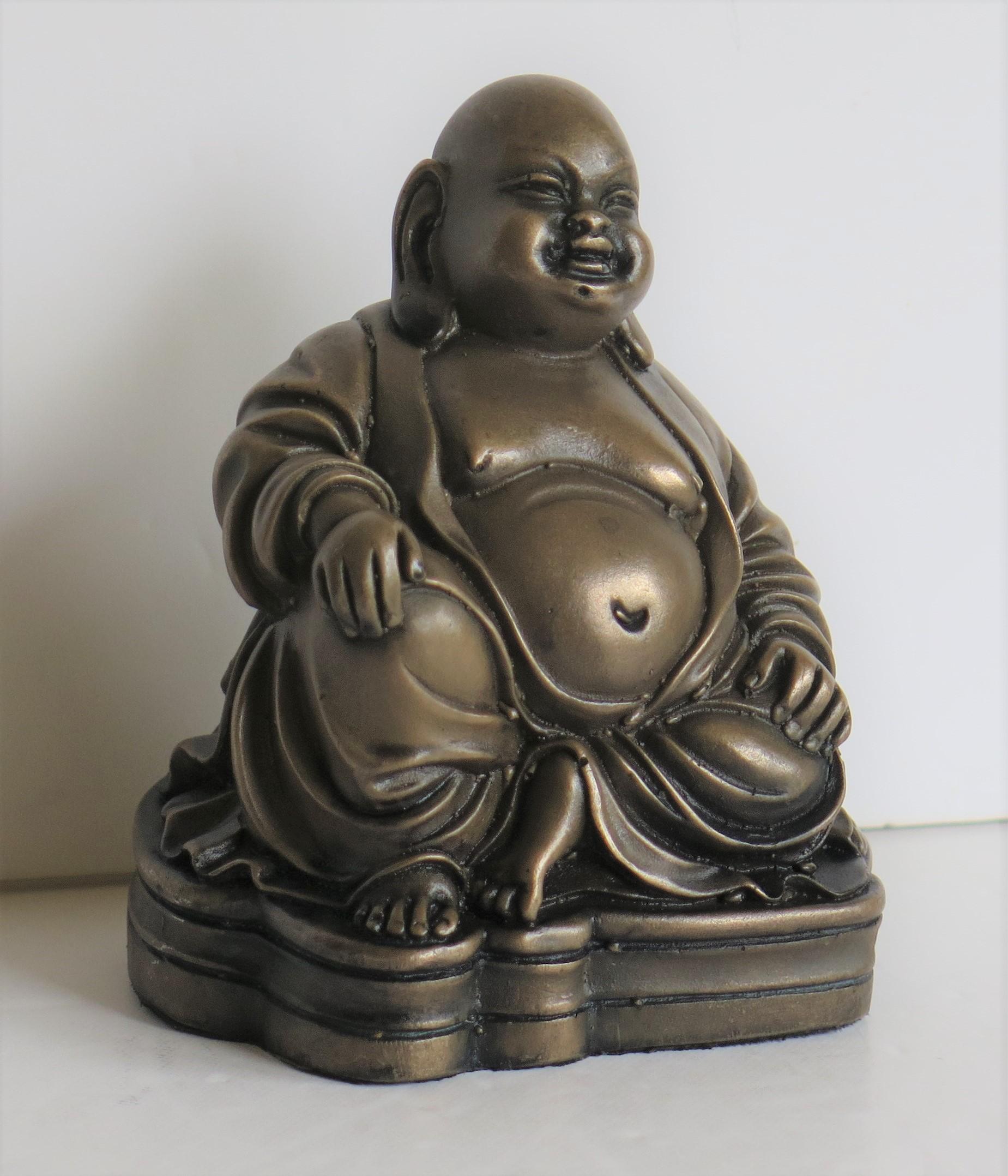This is a very good small bronze metal statue or sculpture of Buddha in a seated position, possibly Chinese or Japanese, which we date to the first half of the 20th century, circa 1920s.

The small statue is well formed with good detail and more