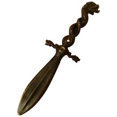 Tagliacarte in bronzo con serpente e delfino